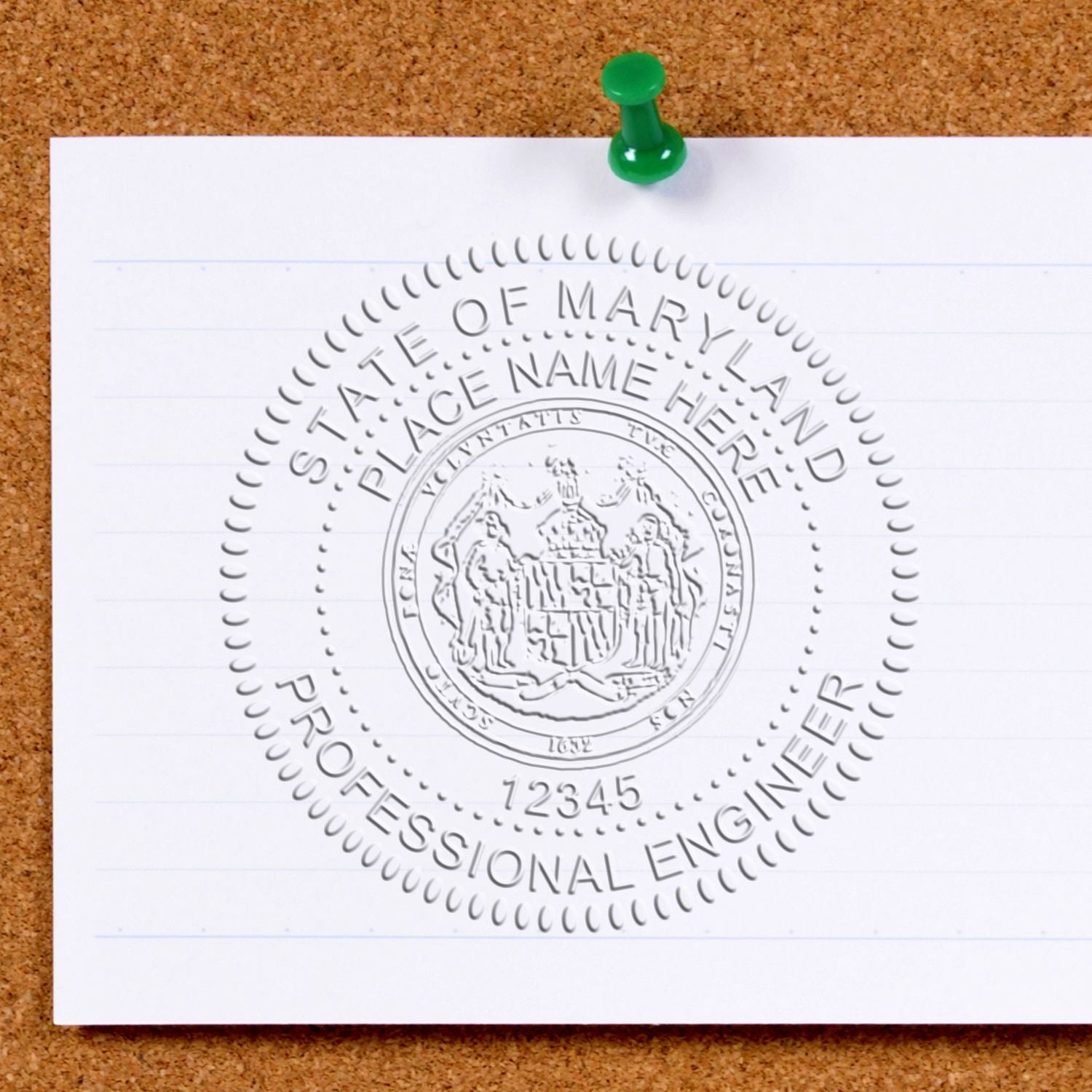 Maryland Professional Engineer seal stamp template on paper pinned to corkboard.