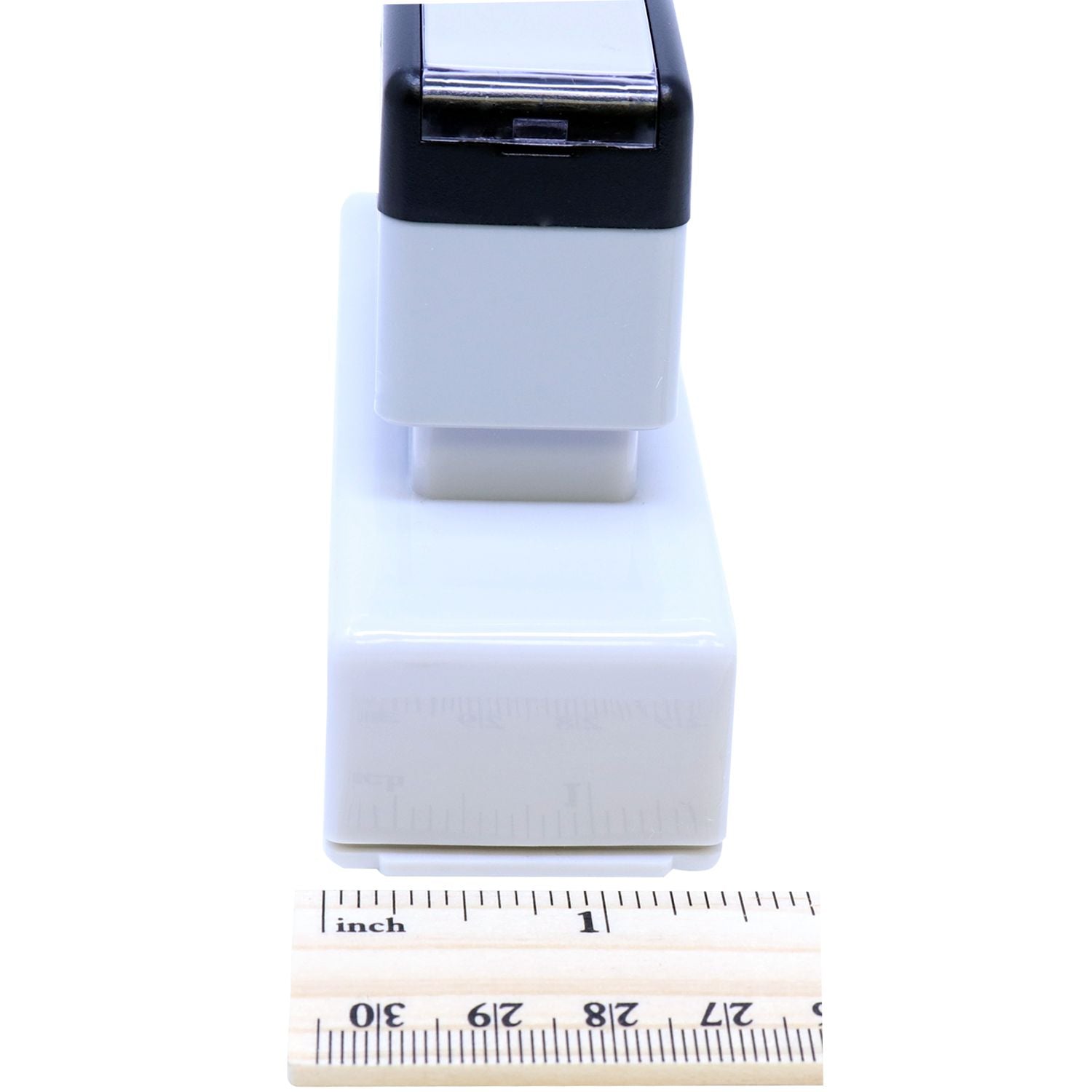 Close-up of compact white and black electronic device module, with ruler showing product size and dimensions for ecommerce.
