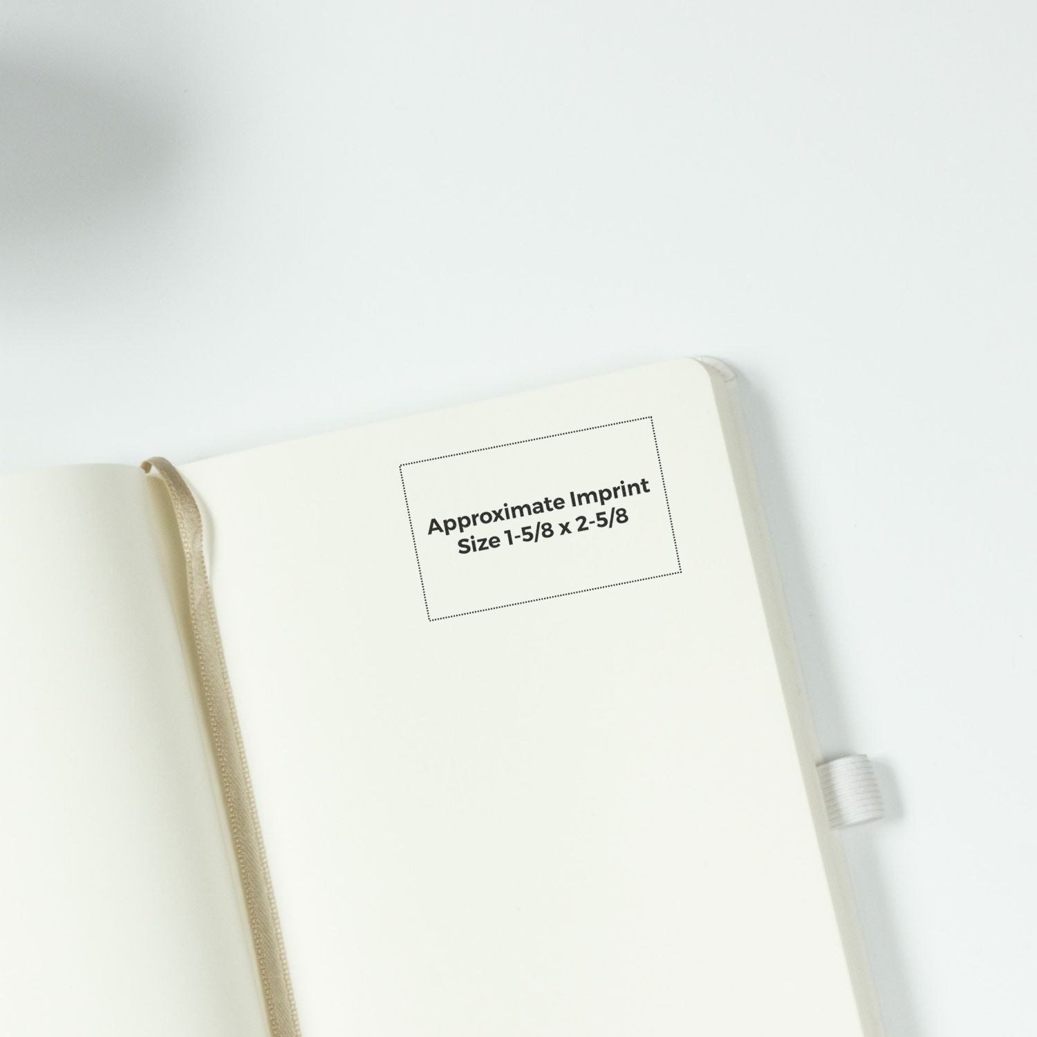 Open cream hardcover notebook with ribbon bookmark and custom imprint area, showcasing approximate imprint size 1-5/8 x 2-5/8.