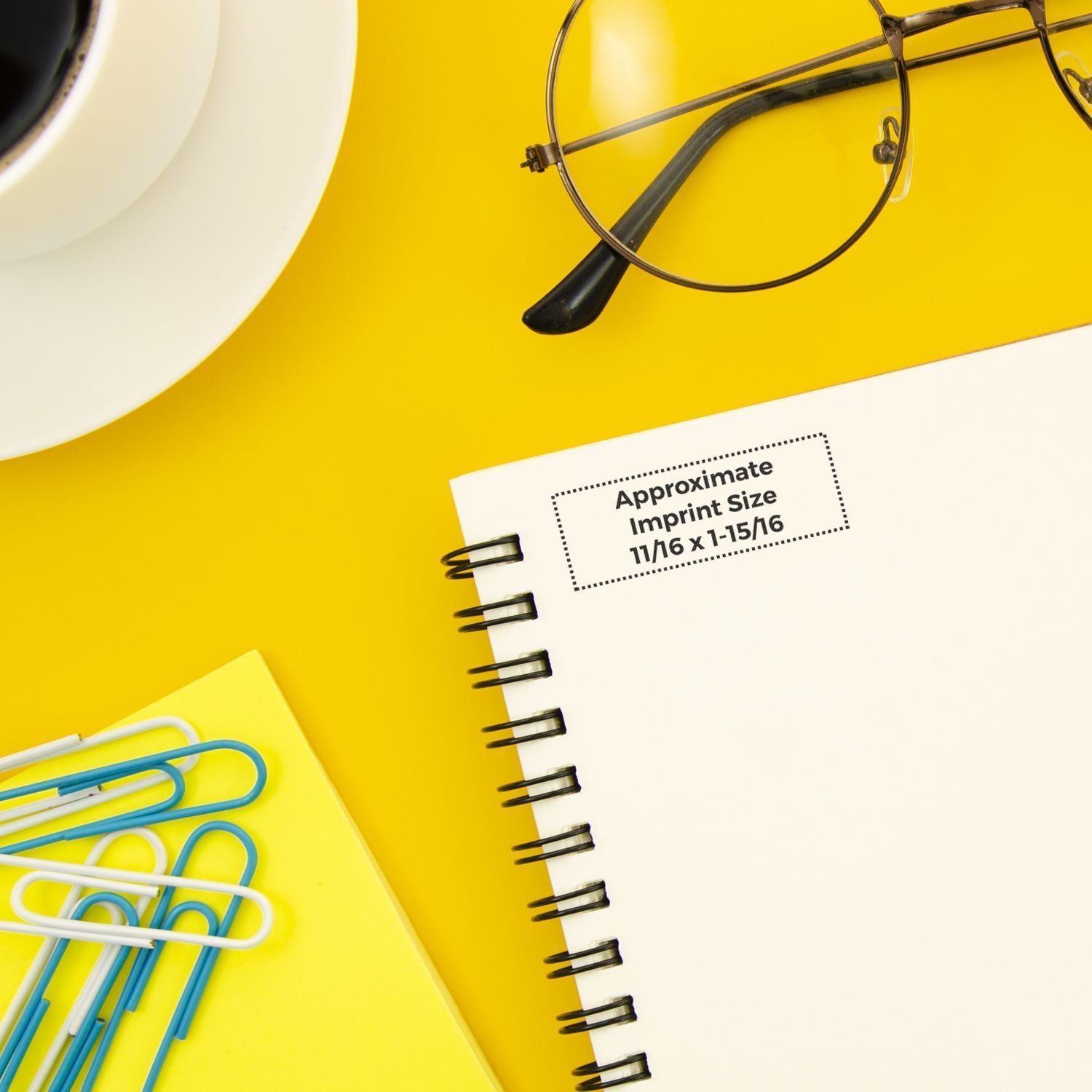 Promotional notebook mockup with wire binding and imprint size label, showing approximate printing area for custom logo placement 11/16 x 1-15/6.