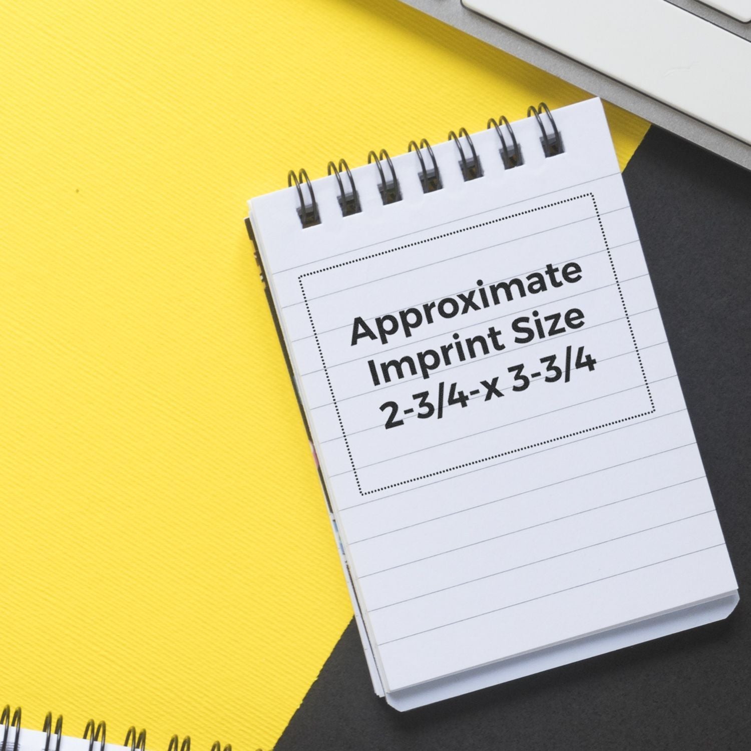 Spiral notebook showing approximate imprint size 2-3/4 x 3-3/4 on a yellow background.