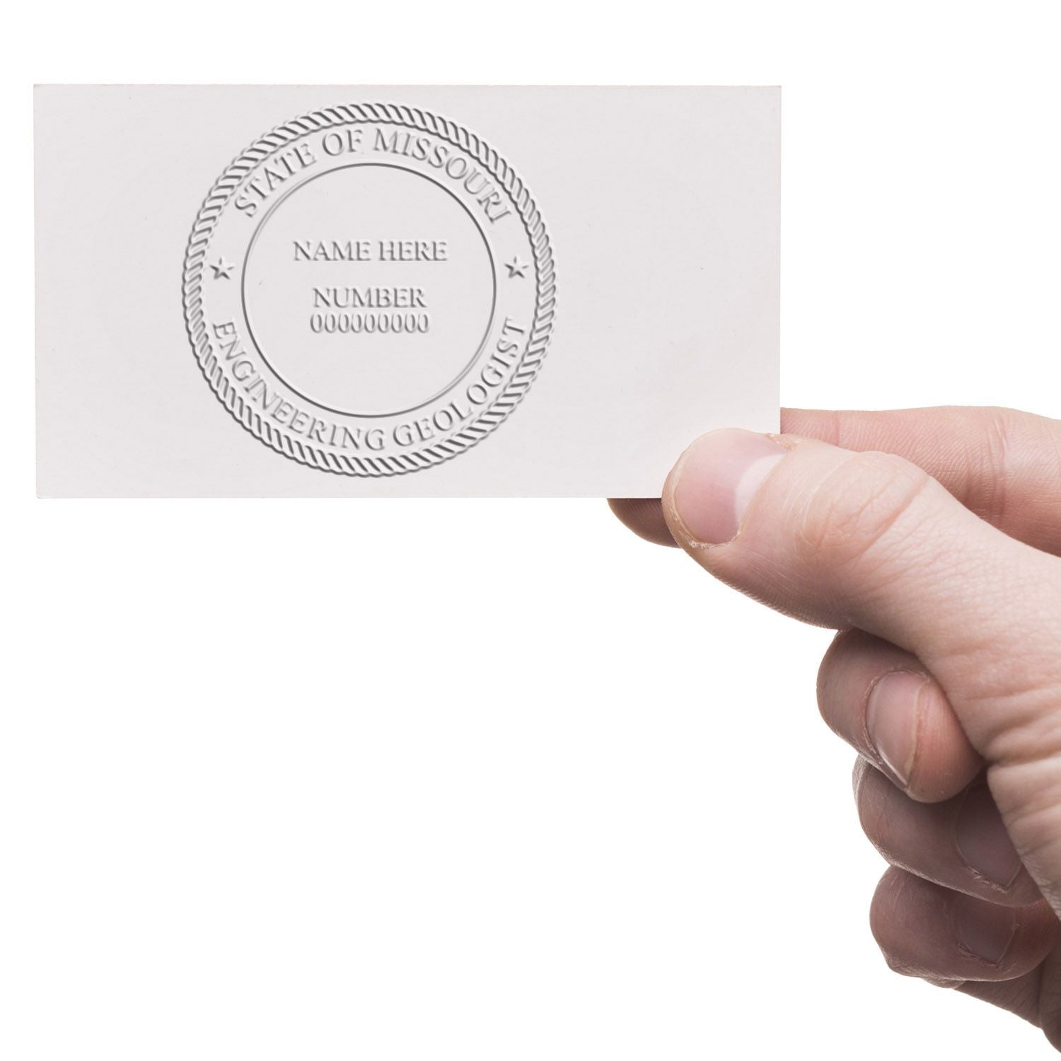 Hand holding a Missouri Engineering Geologist business card with embossed state seal and name placeholder.