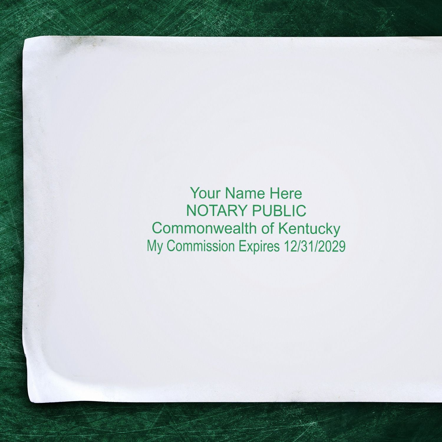 Kentucky notary public certificate with commission expiration date on white paper against a green background.