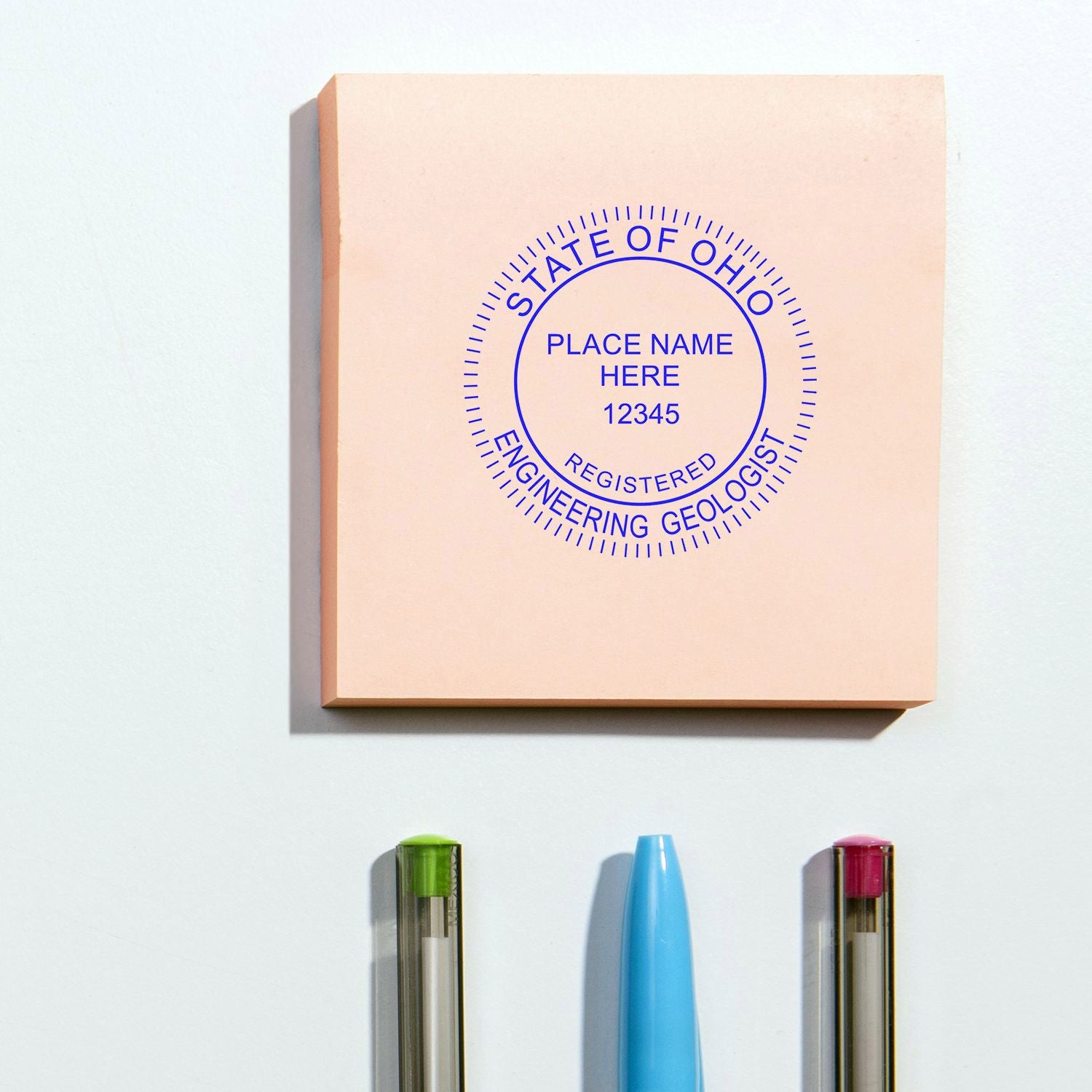 State of Ohio registered engineering geologist seal on a custom office stamp with pens below.