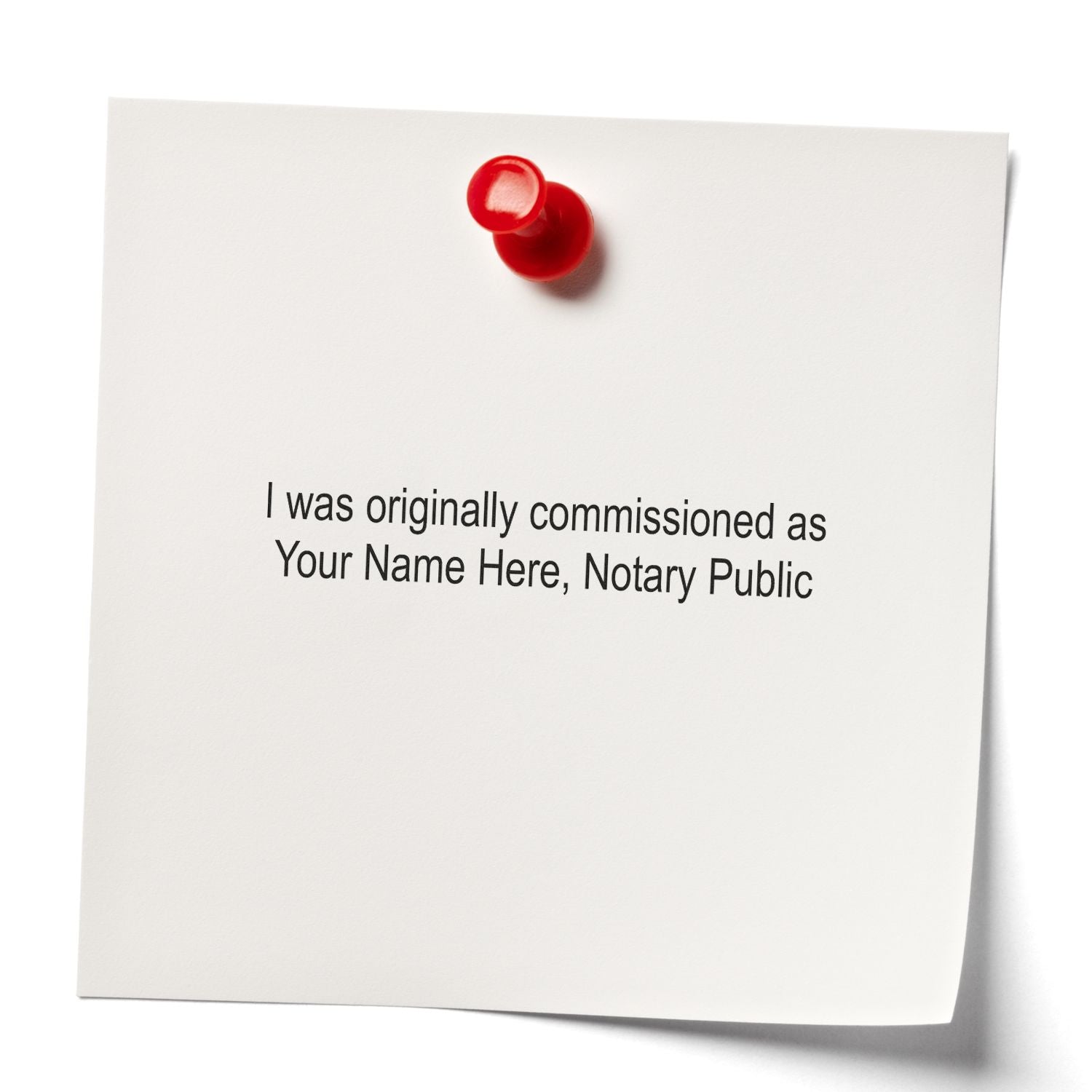 White note pinned with red pushpin reading I was originally commissioned as Your Name Here, Notary Public.