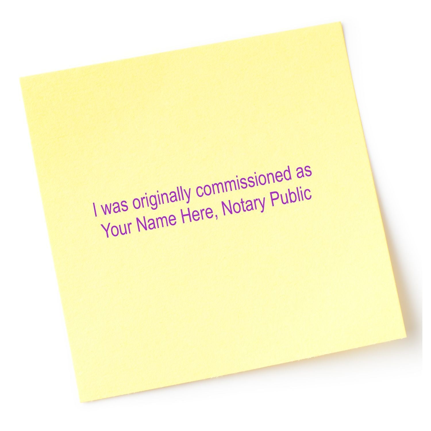 Yellow sticky note with purple text reading I was originally commissioned as Your Name Here, Notary Public on a white background.