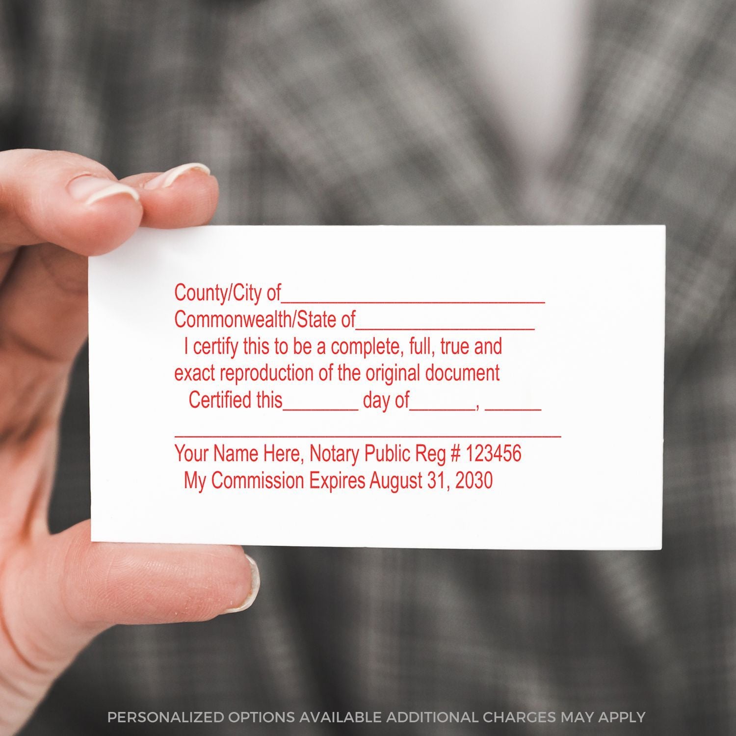 Hand holding a notary public business card template with certification text and commission details.