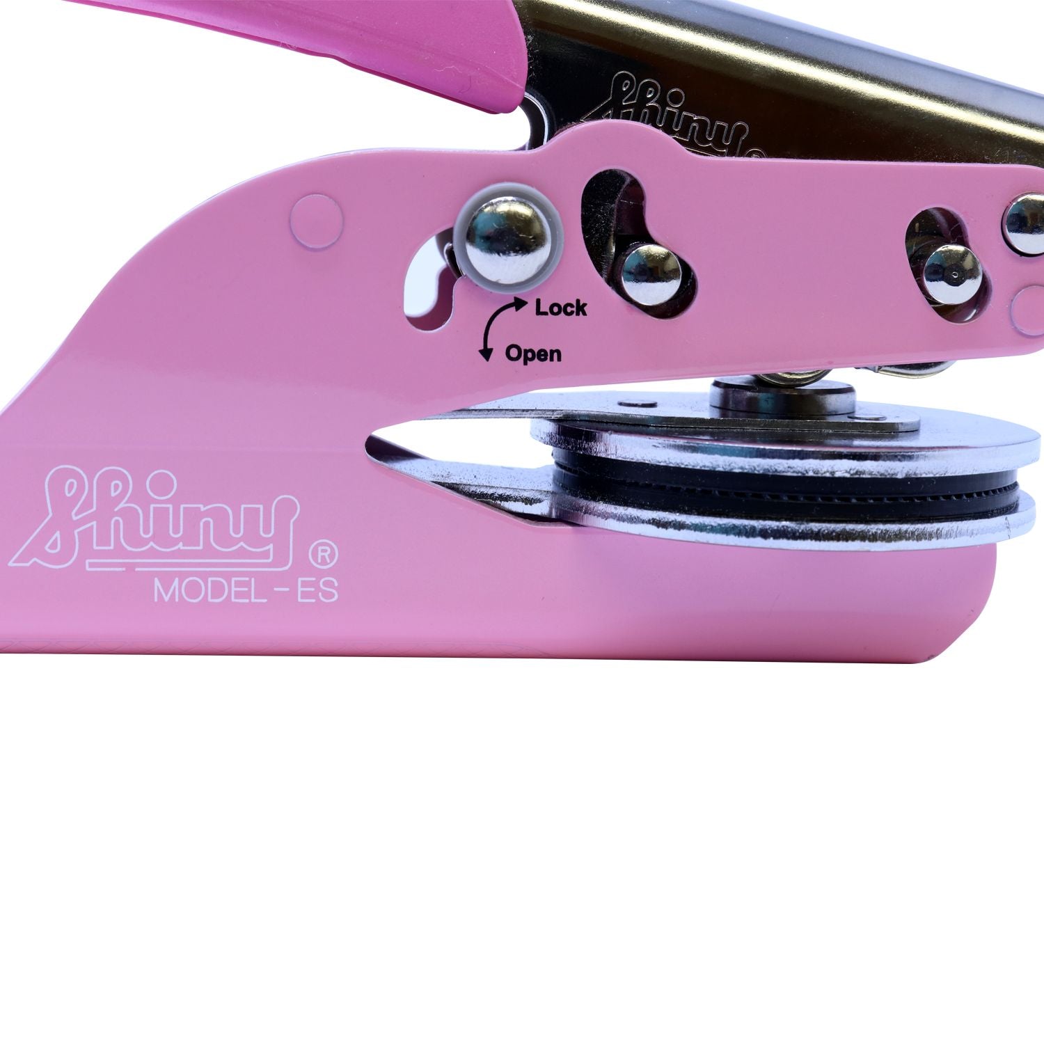 Close-up of a pink Shiny Model-ES paper hole punch with lock and open switch.