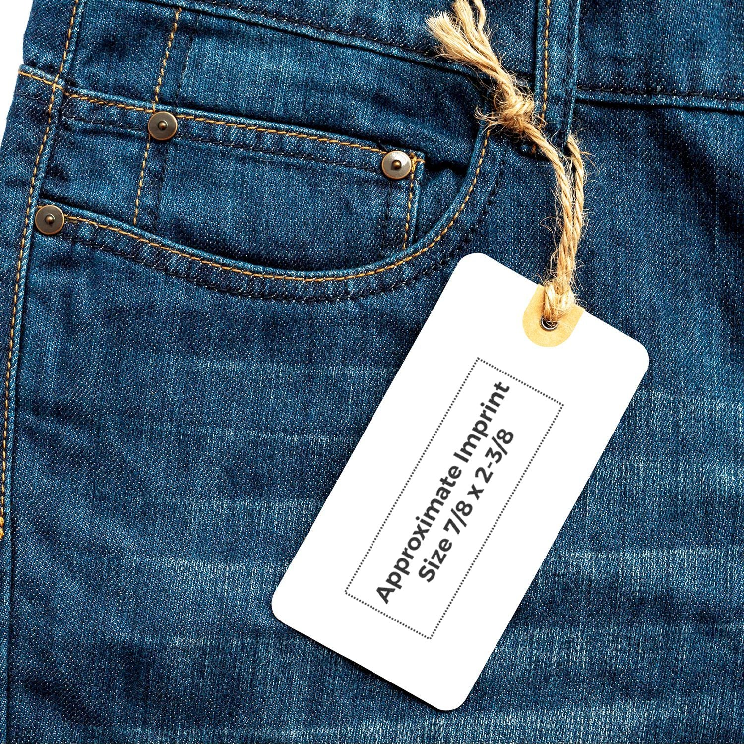 Close-up of blue denim jeans pocket with blank clothing tag for custom apparel branding.