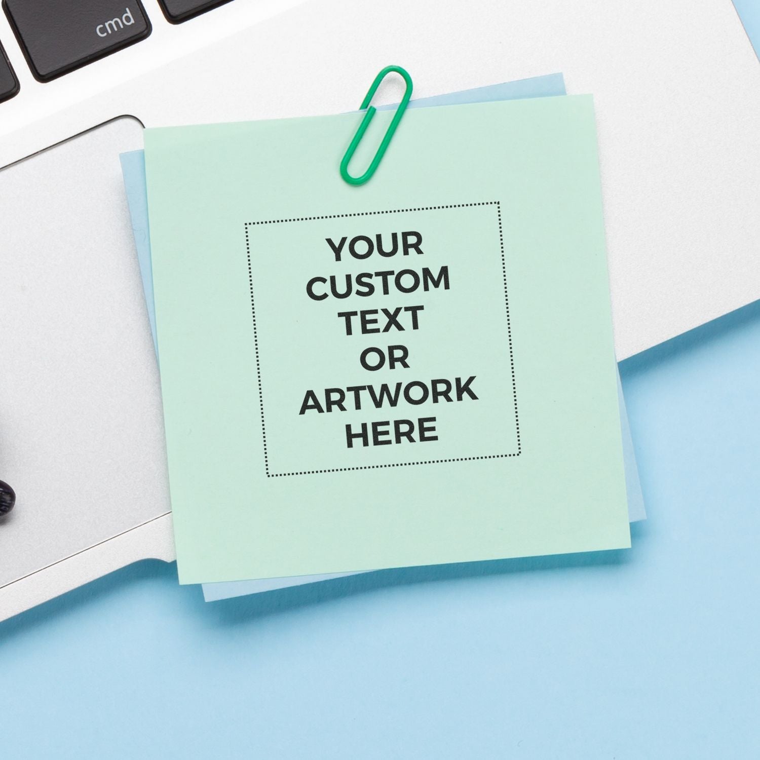 Printable custom text or artwork mockup on pastel paper with binder clip, ideal for personalized greeting cards and designs.