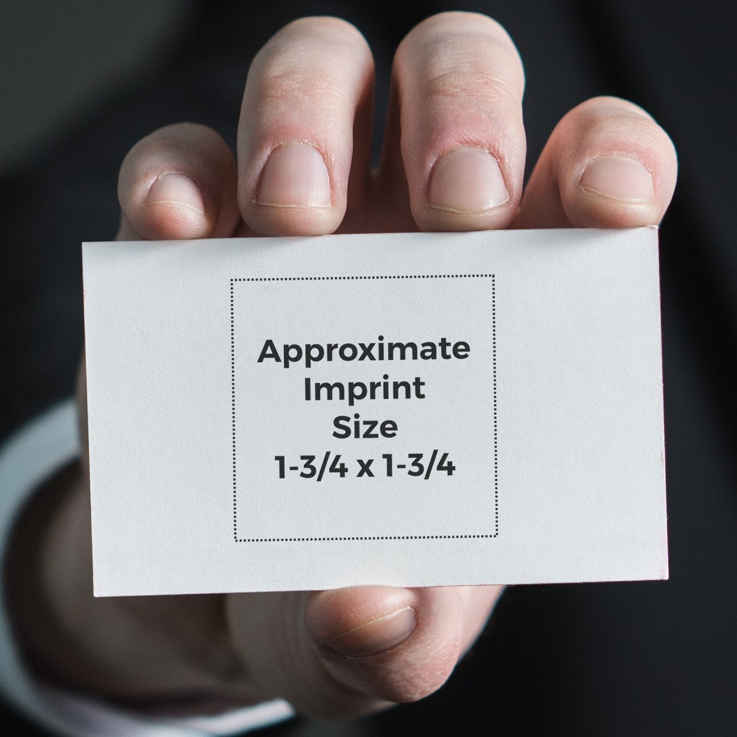 Hand holding card labeled Approximate Imprint Size 1-3/4 x 1-3/4 for stamping, engraving, or printing.