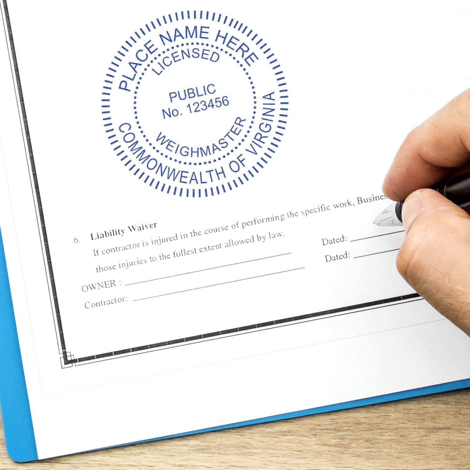 Hand signing a licensed liability waiver document with Commonwealth of Virginia stamp and seal.