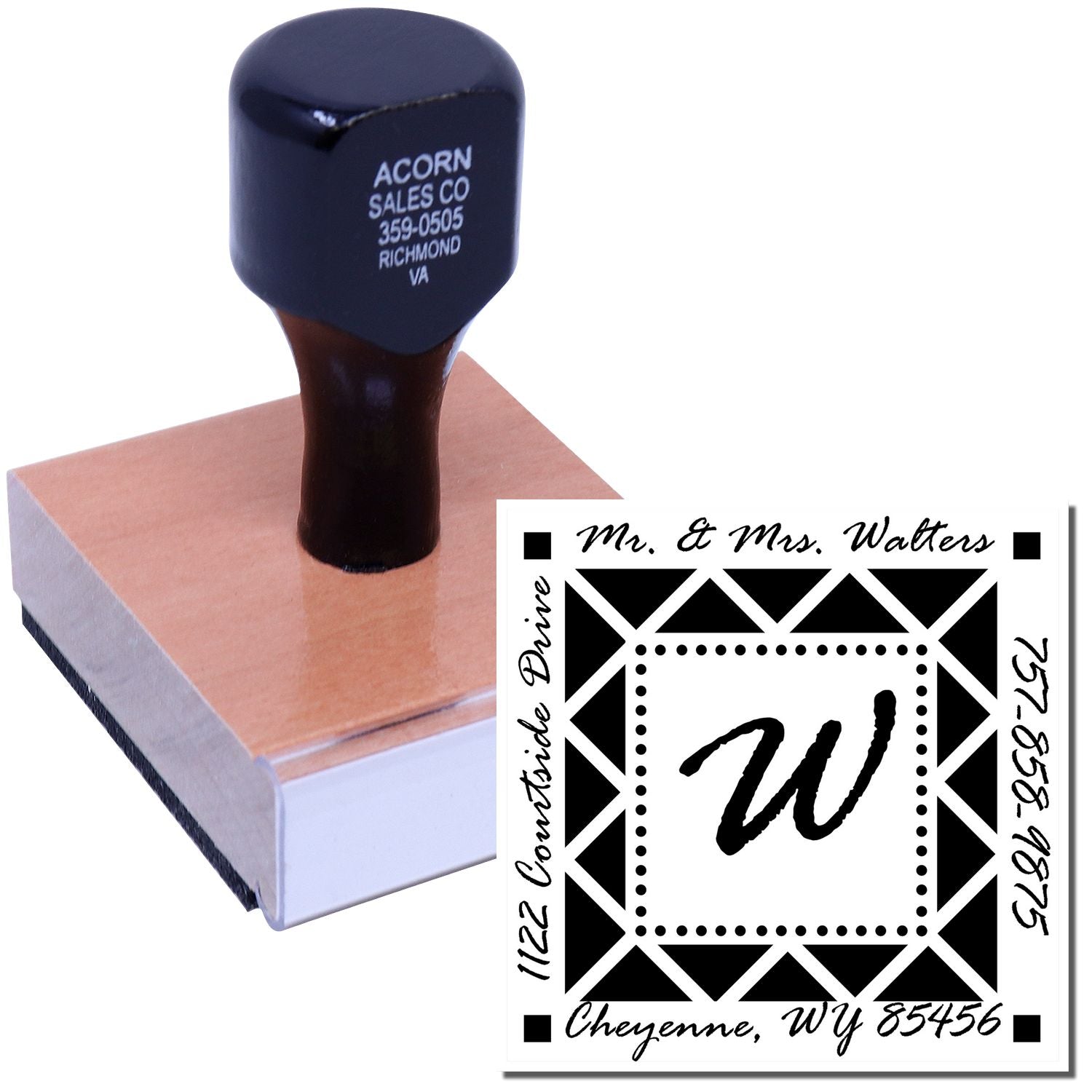 Custom rubber address stamp with wooden handle, showing a monogram return address design for wedding stationery.