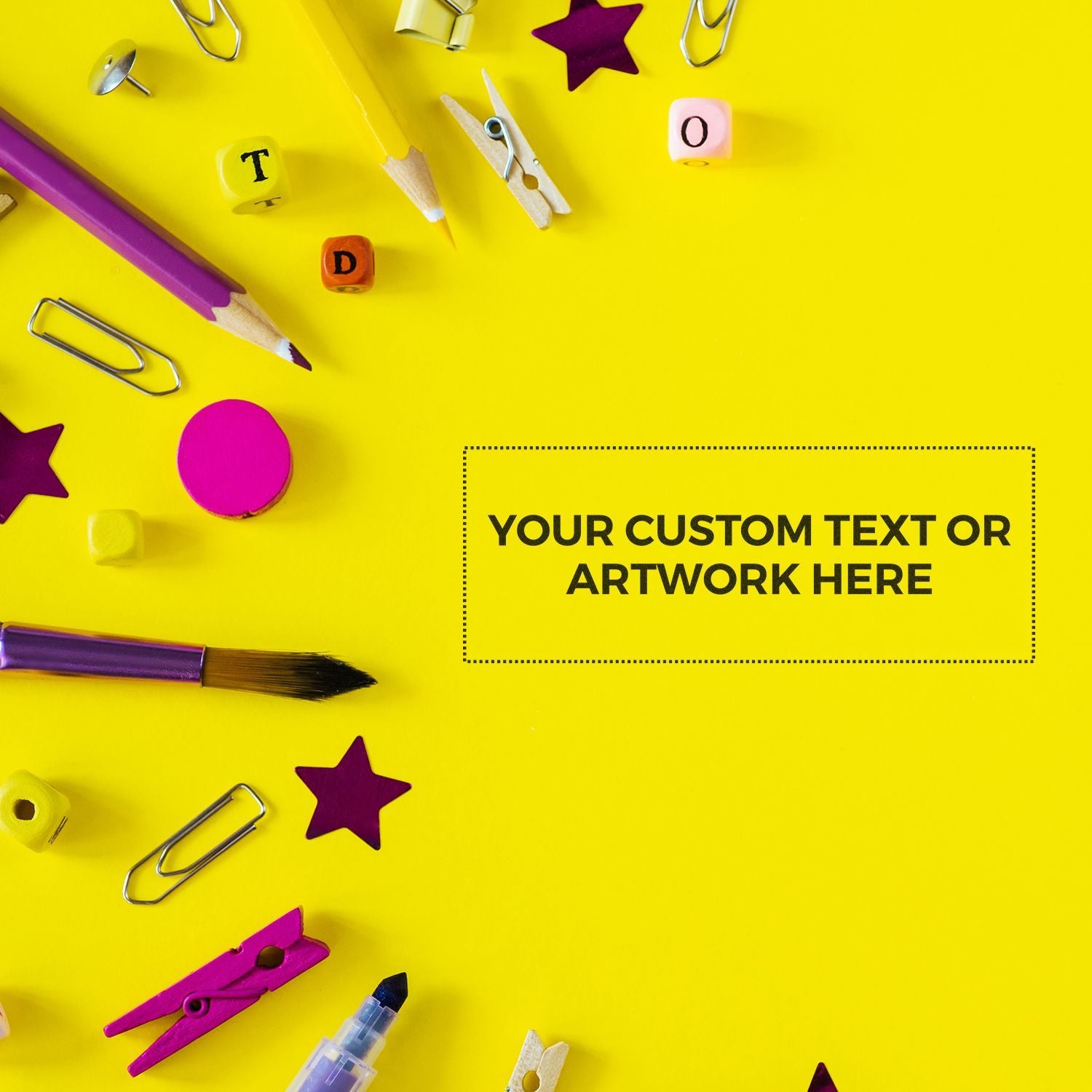 Bright yellow school supplies flat lay with clips, pencils, and alphabet blockscustom text box for education or classroom art design.