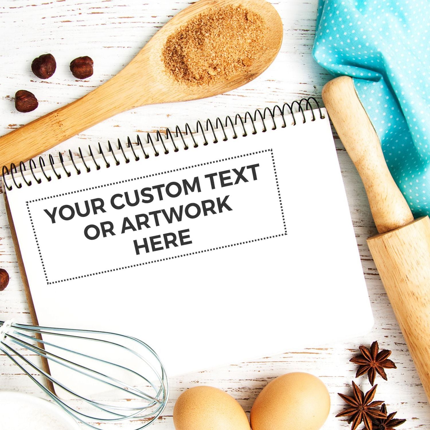 Baking ingredients and utensils with a blank template for your custom text or artwork on a recipe book page.