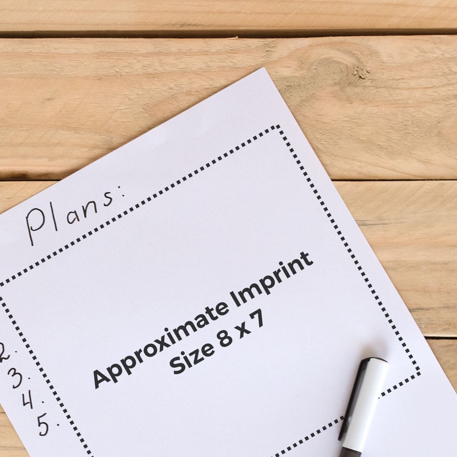 Printable template showing approximate imprint size 8 x 7 for custom printing, with pen on wooden table.