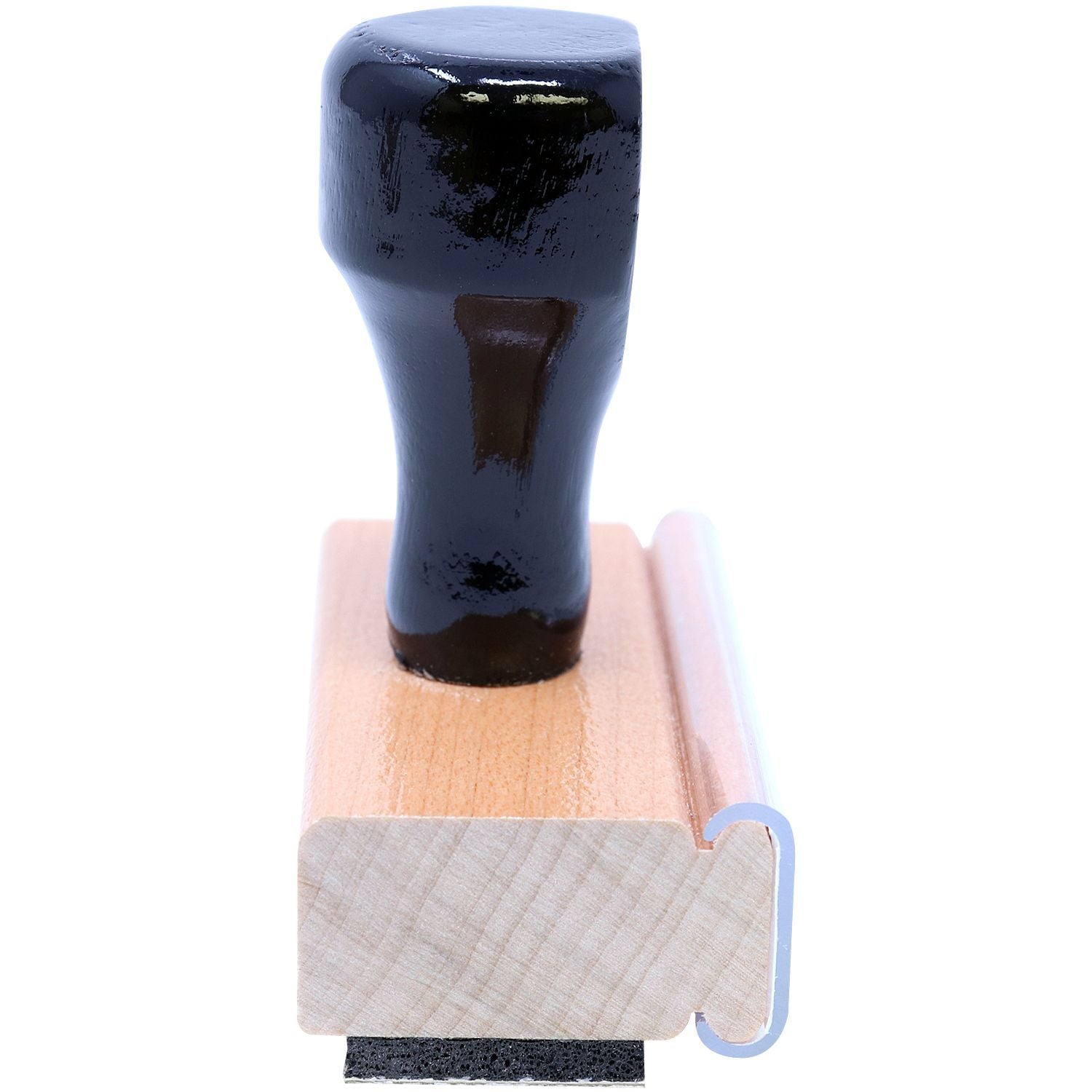 Close-up of a wooden rubber stamp with black handle isolated on white background