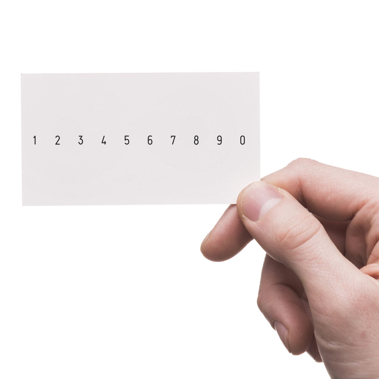 Hand holding a white card with numbers 1 to 0, minimal number typography on a white background.