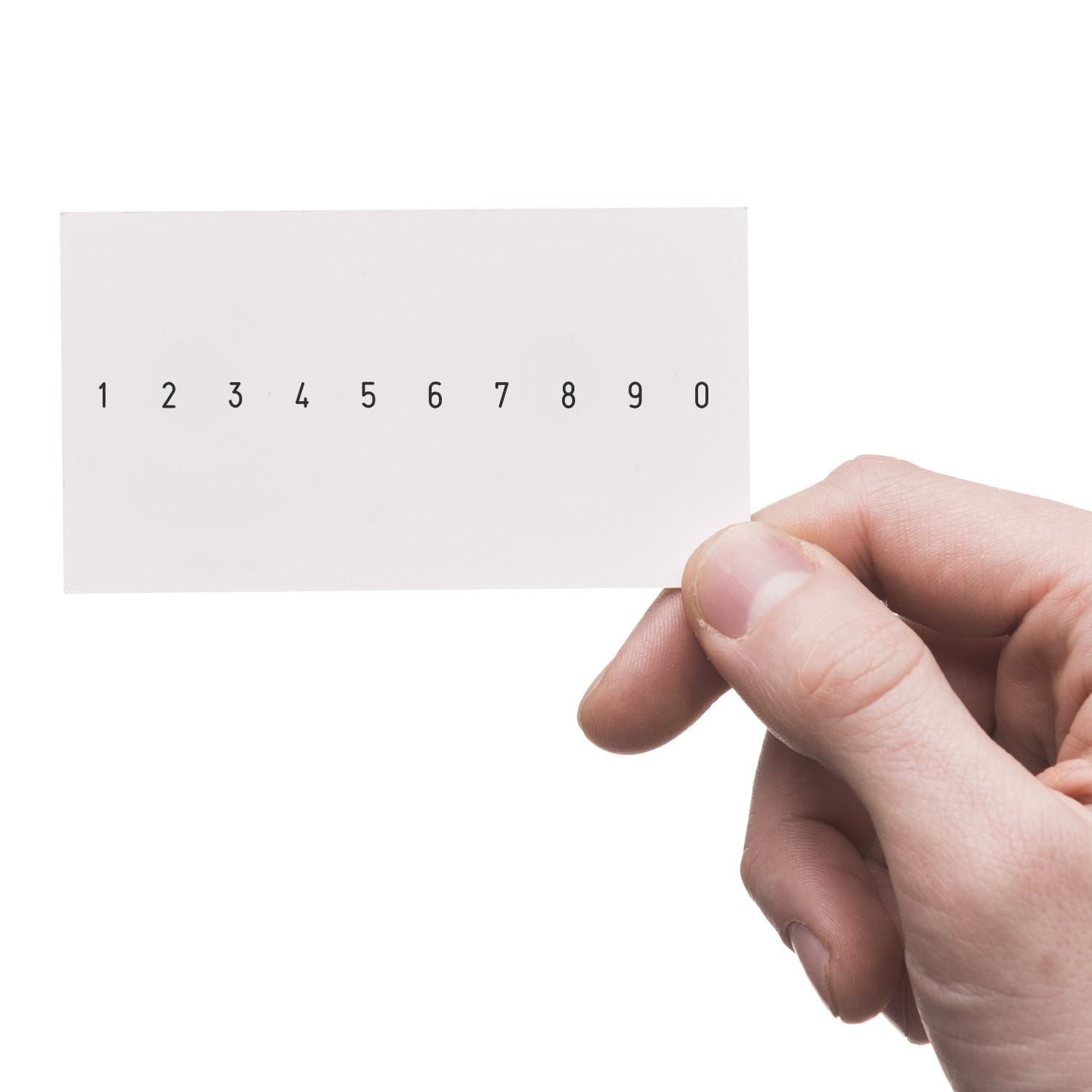 Close-up of hand holding a numbered card with digits 1 to 0 on a white background