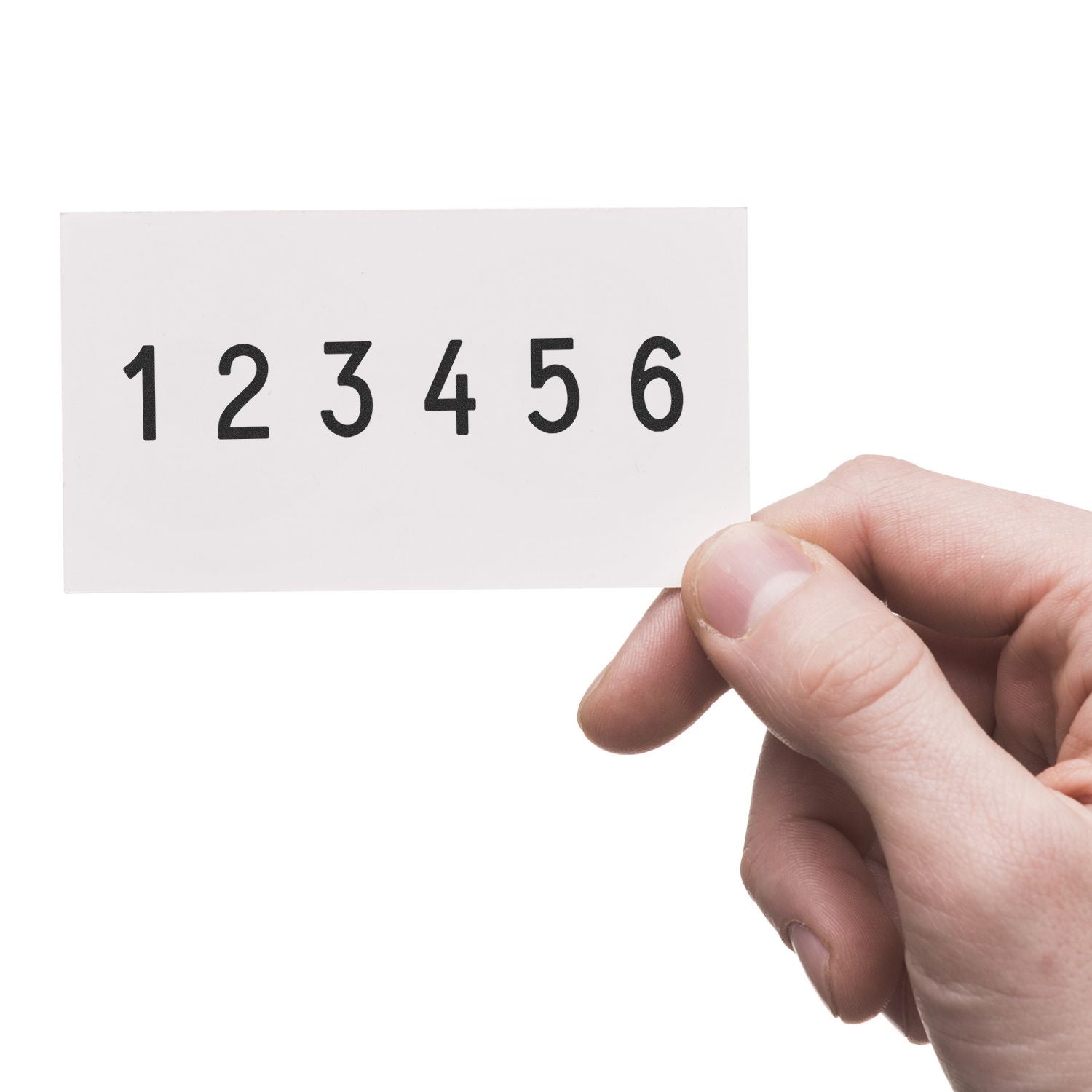 Hand holding a white card displaying number sequence 1 2 3 4 5 6 on a white background.