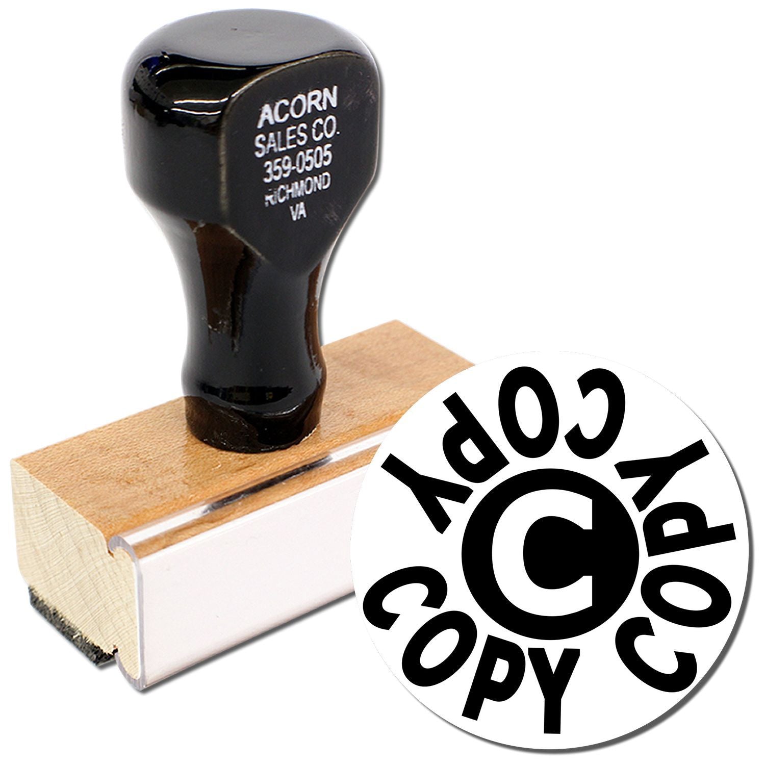 Custom copyright stamp with black handle and wooden mount, featuring Acorn Sales Co. imprint.