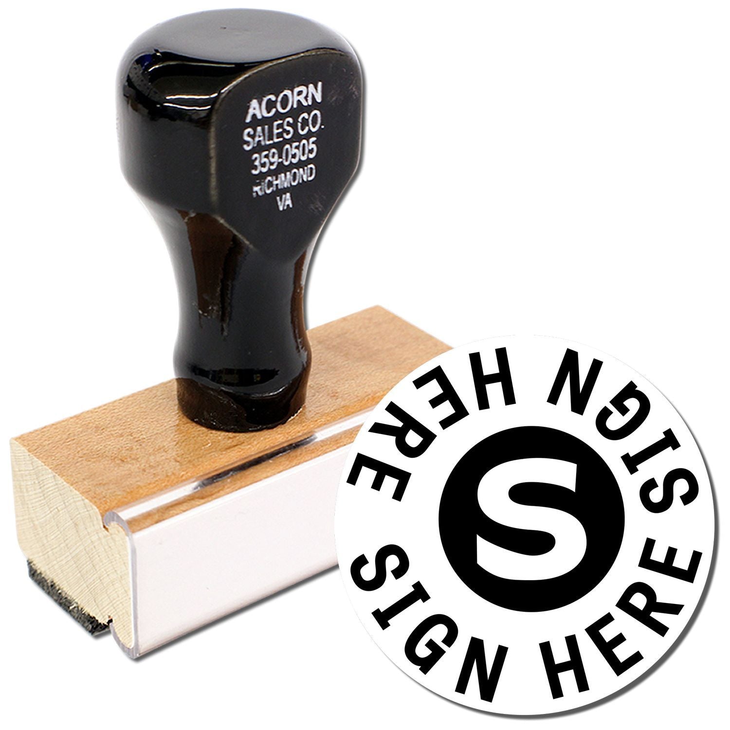 Black custom Sign Here rubber stamp with wooden base and branded handle on white background.