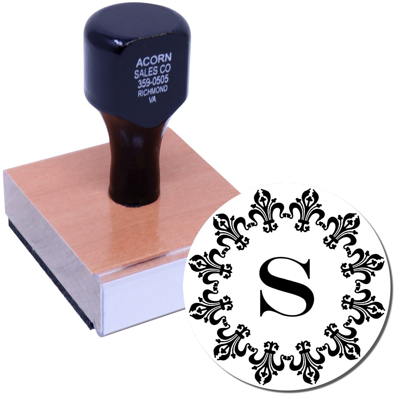 Custom monogram rubber stamp with ornate initial S for personalized stationery, shown on a wooden hand stamp.