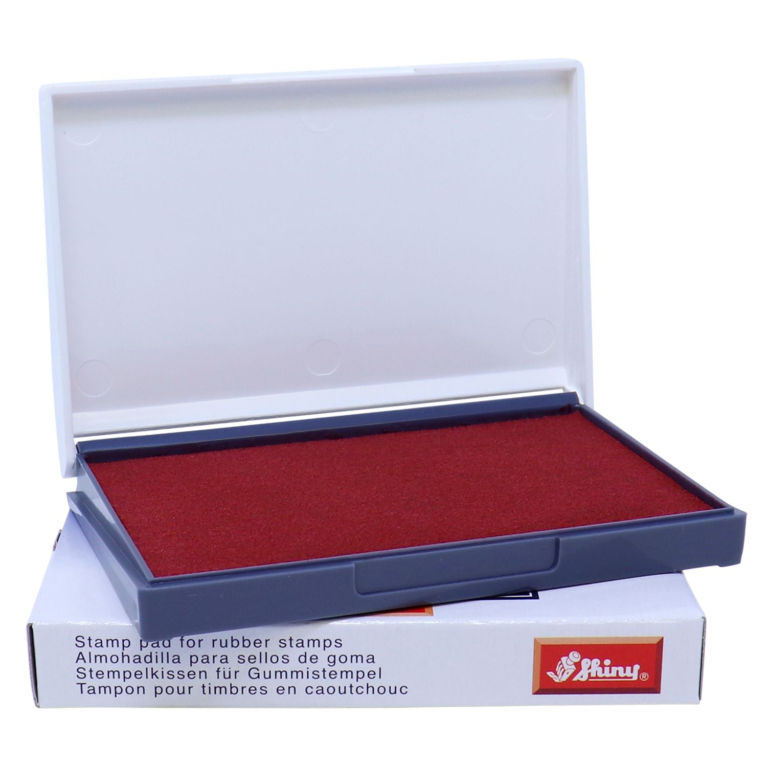 Open red rubber stamp ink pad in plastic case with packaging, ideal stamp pad for rubber stamps.