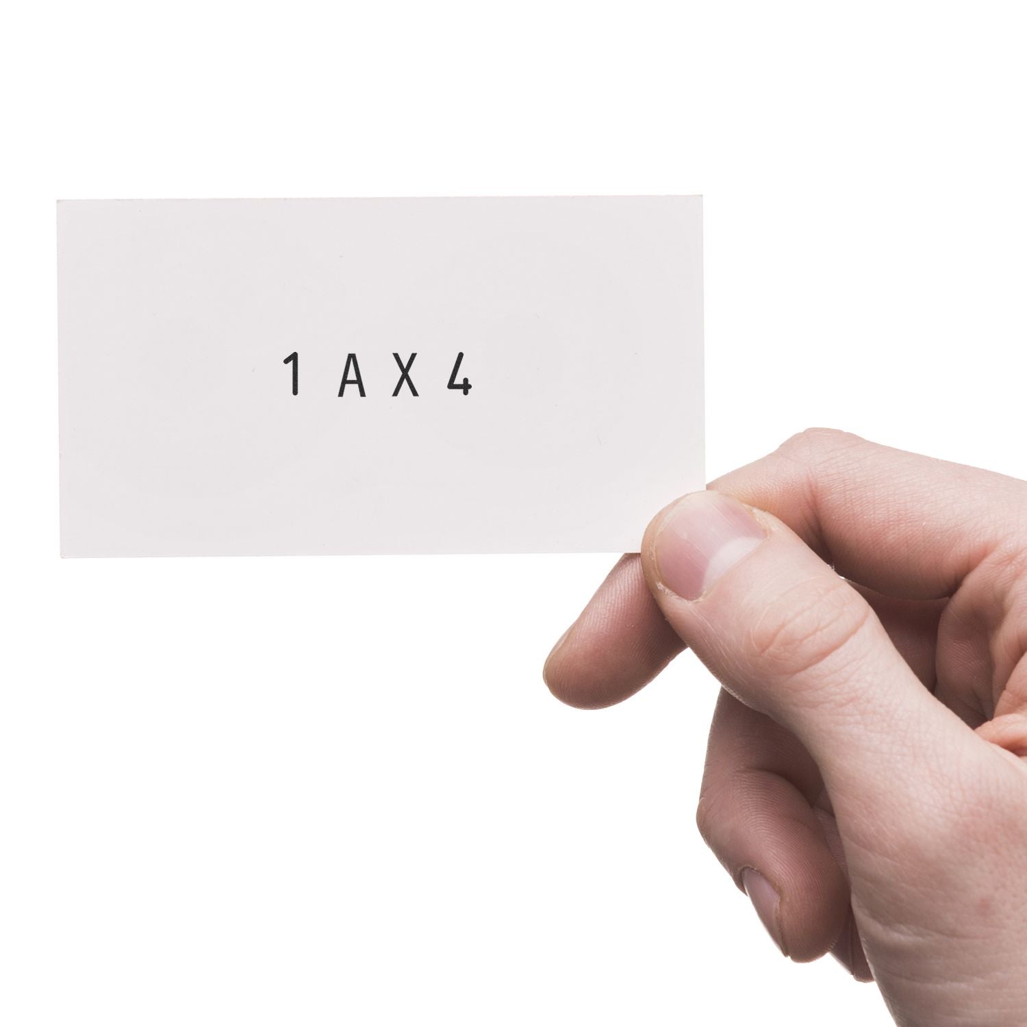 Close-up of hand holding a white business card with 1AX4 text on a white background.