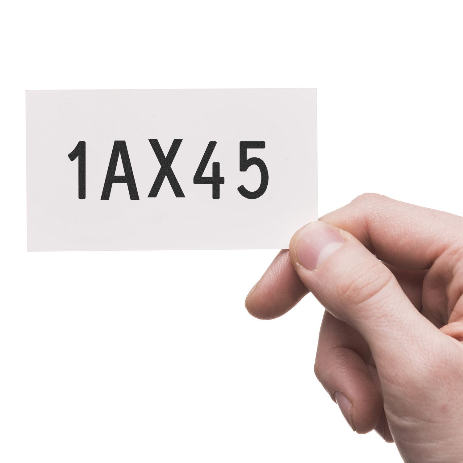 Hand holding a white label card with the code 1AX45 printed in black text.