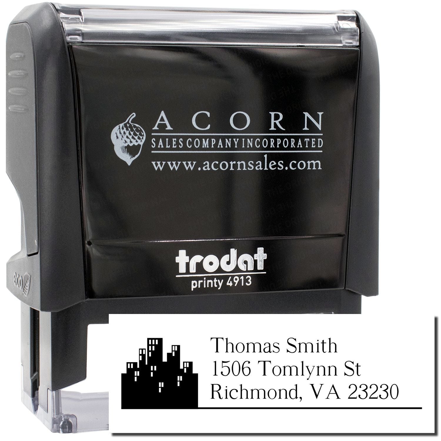 Custom self-inking rubber stamp with Acorn Sales Company logo and personalized address imprint, shown on Trodat Printy 4913.