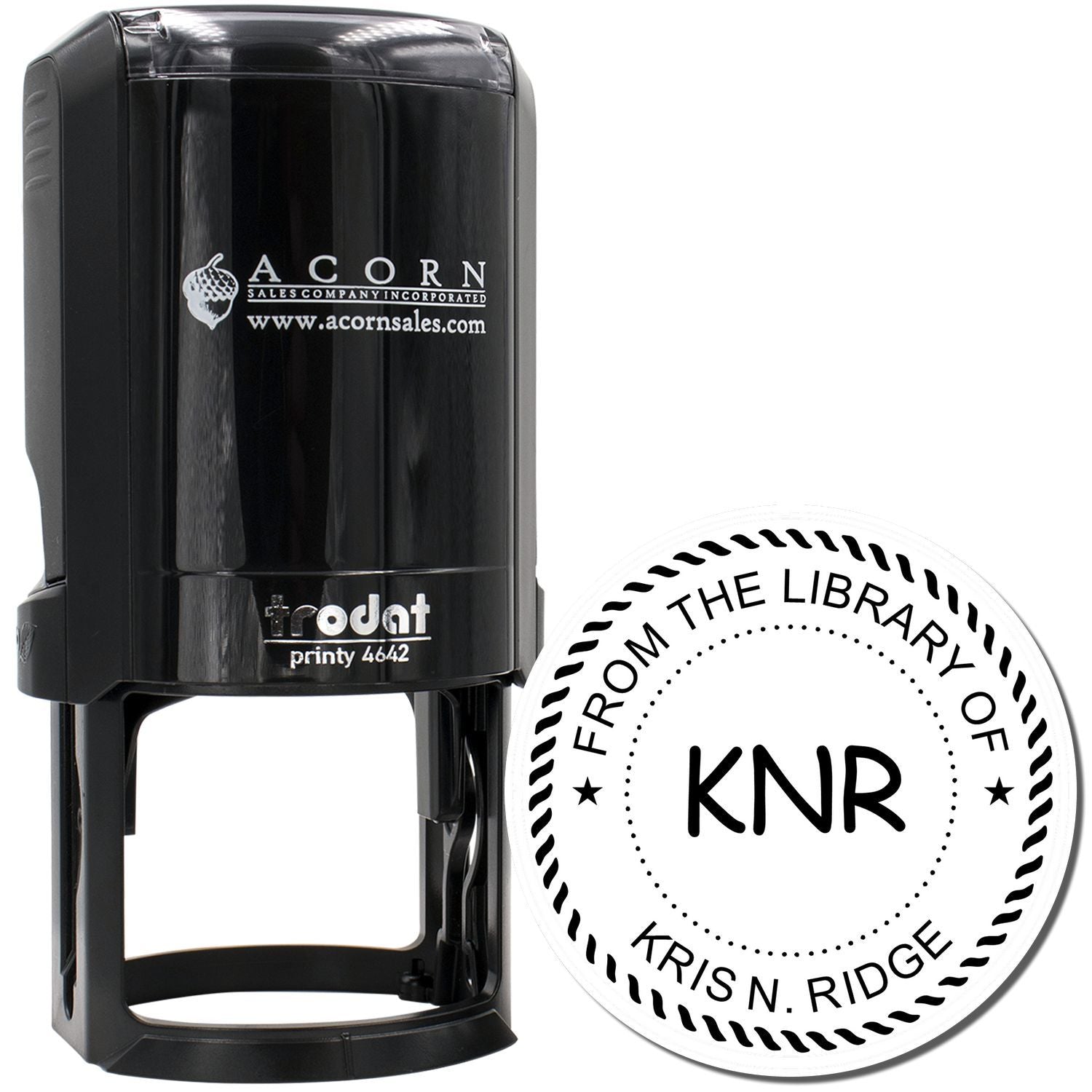Custom self-inking rubber library stamp with round From the Library Of design for personalized books and circulation marking.