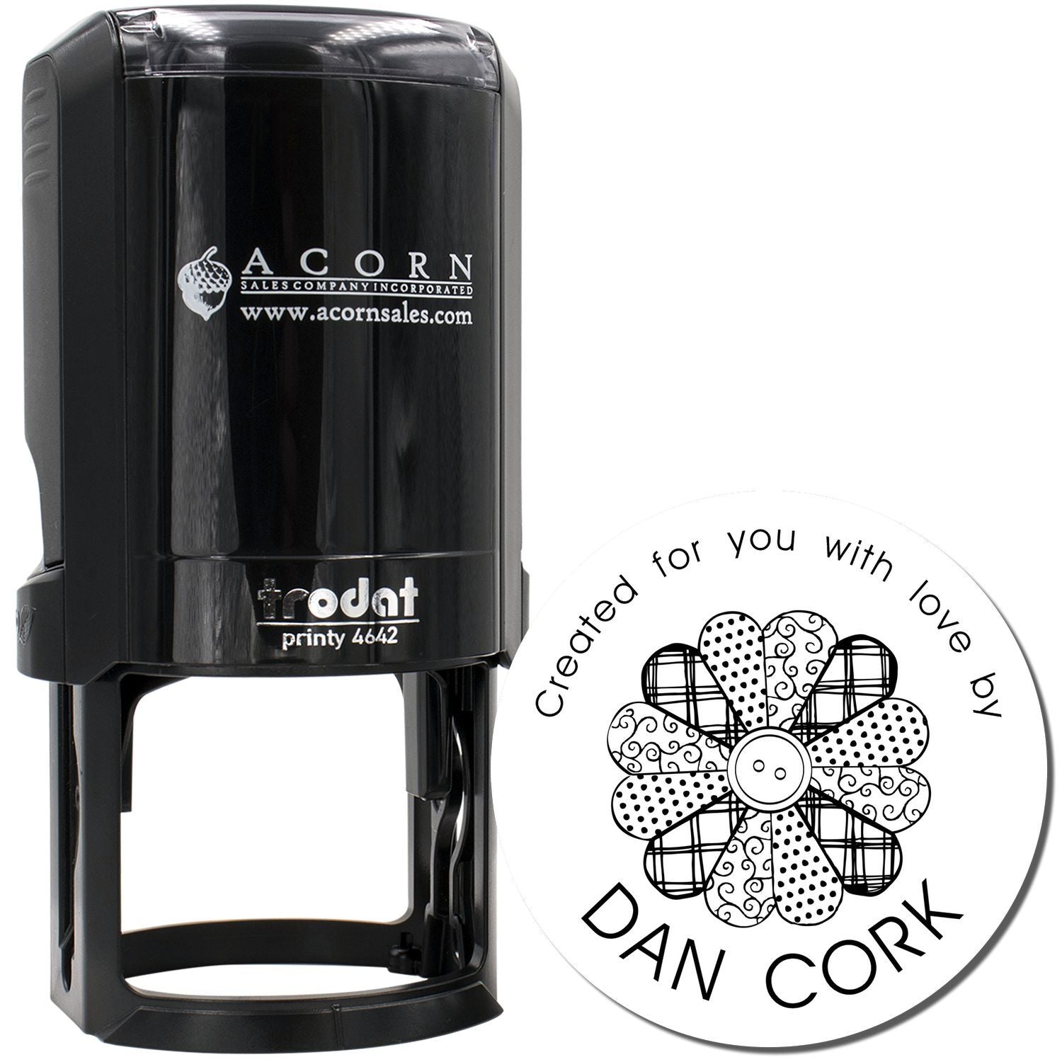 Trodat self-inking custom rubber stamp with round floral logo and Created for you with love by Dan Cork text.