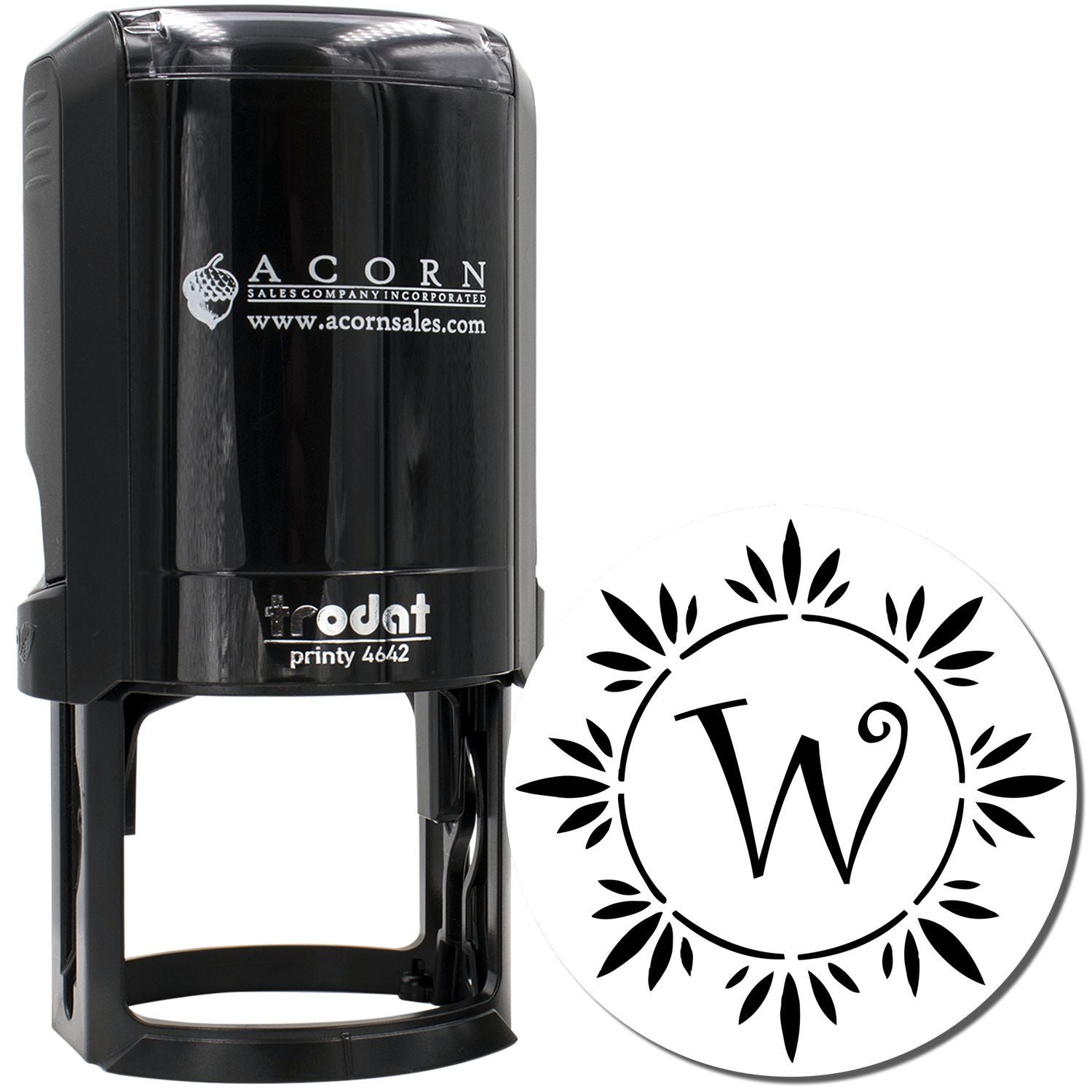 Custom self-inking rubber stamp with decorative monogram W and floral border for business branding.