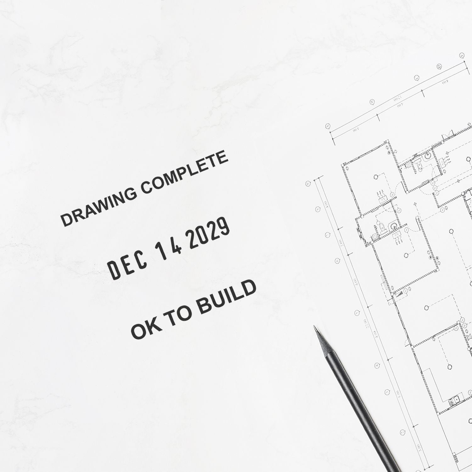 Architectural blueprint marked drawing complete and OK to build with pencil on plan drawings.