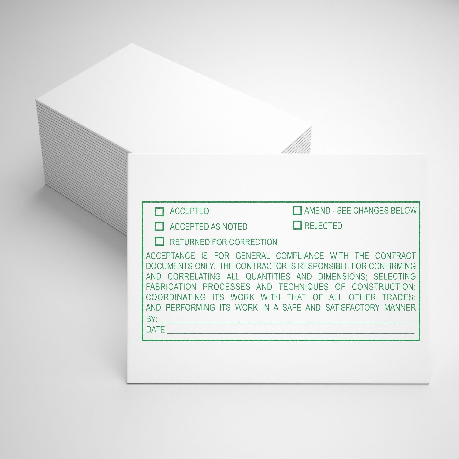 Stack of white approval stamp cards with green construction document acceptance checklist and sign-off fields.