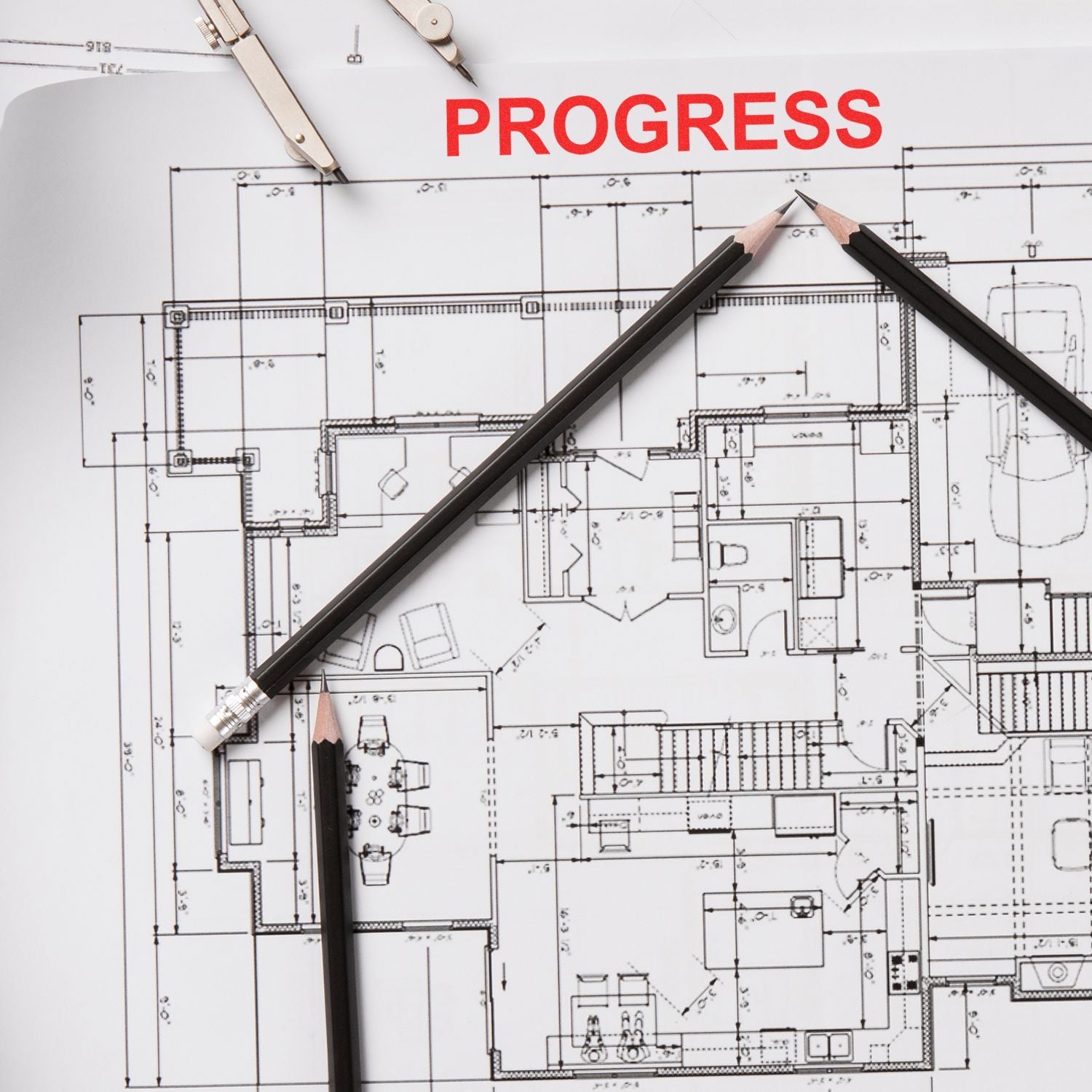 Architectural blueprint with pencils forming a house outline and the word PROGRESS, symbolizing home design and construction planning.