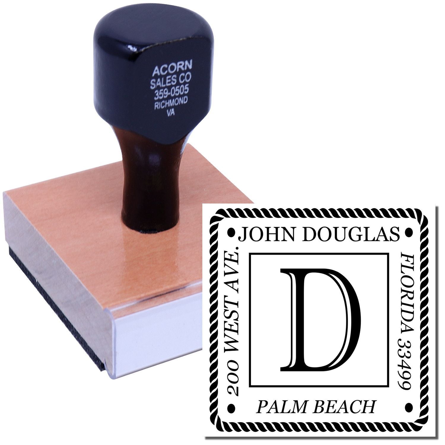 Custom rubber stamp with monogram D and personalized address design for business branding and stationery.