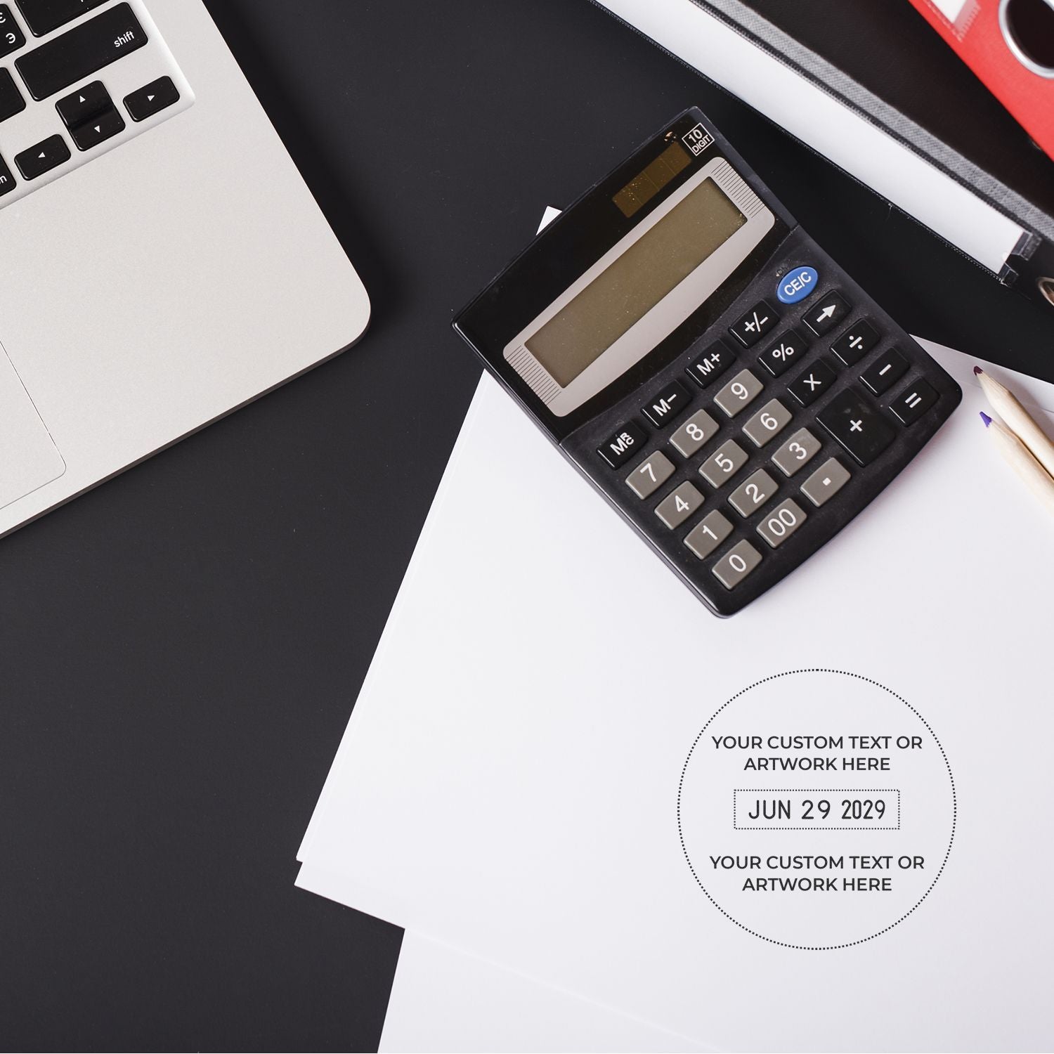 Top view of office desk with laptop, calculator, and blank business documents for accounting and financial planning.