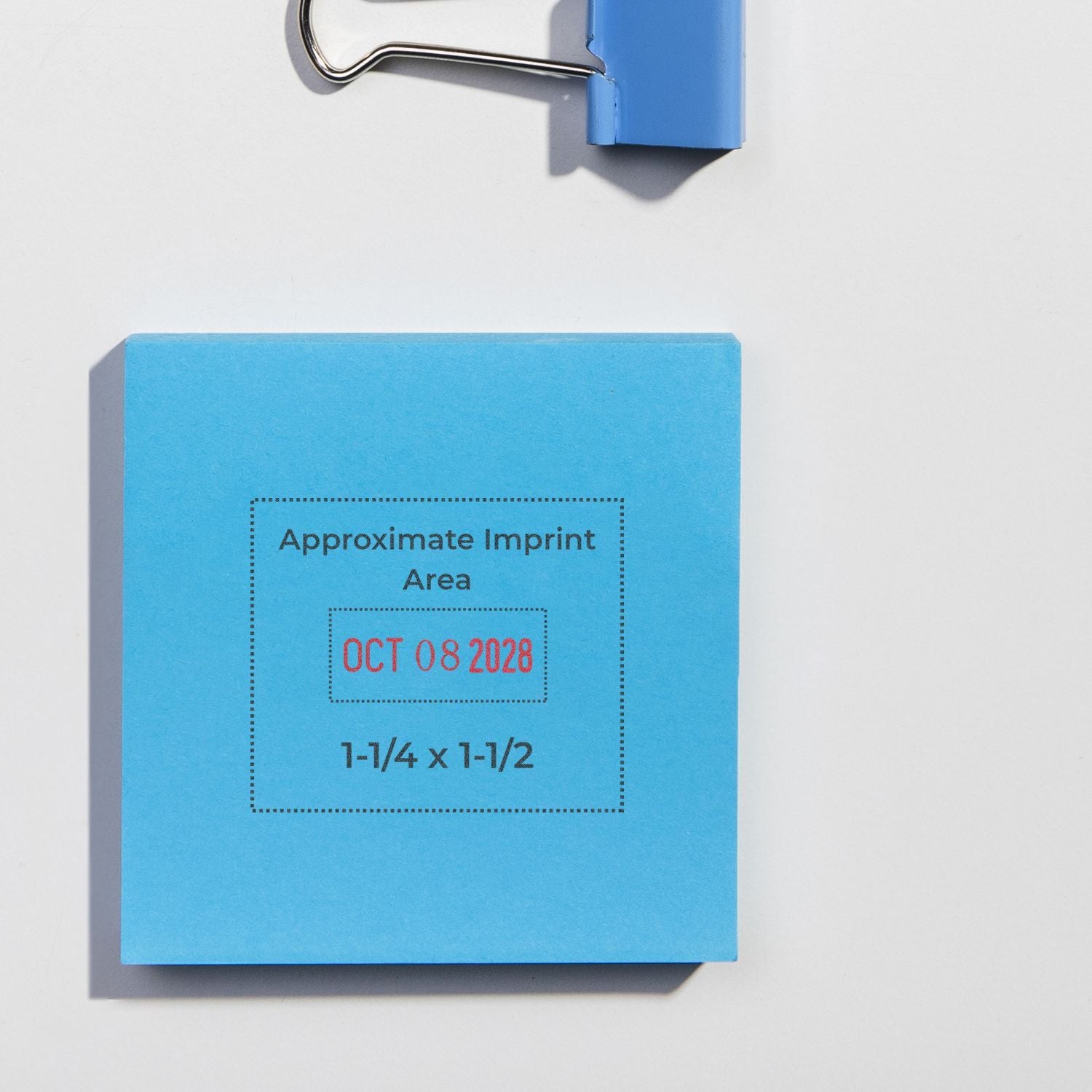 Blue sticky note with binder clip showing approximate imprint area and October 08, 2028 date stamp.