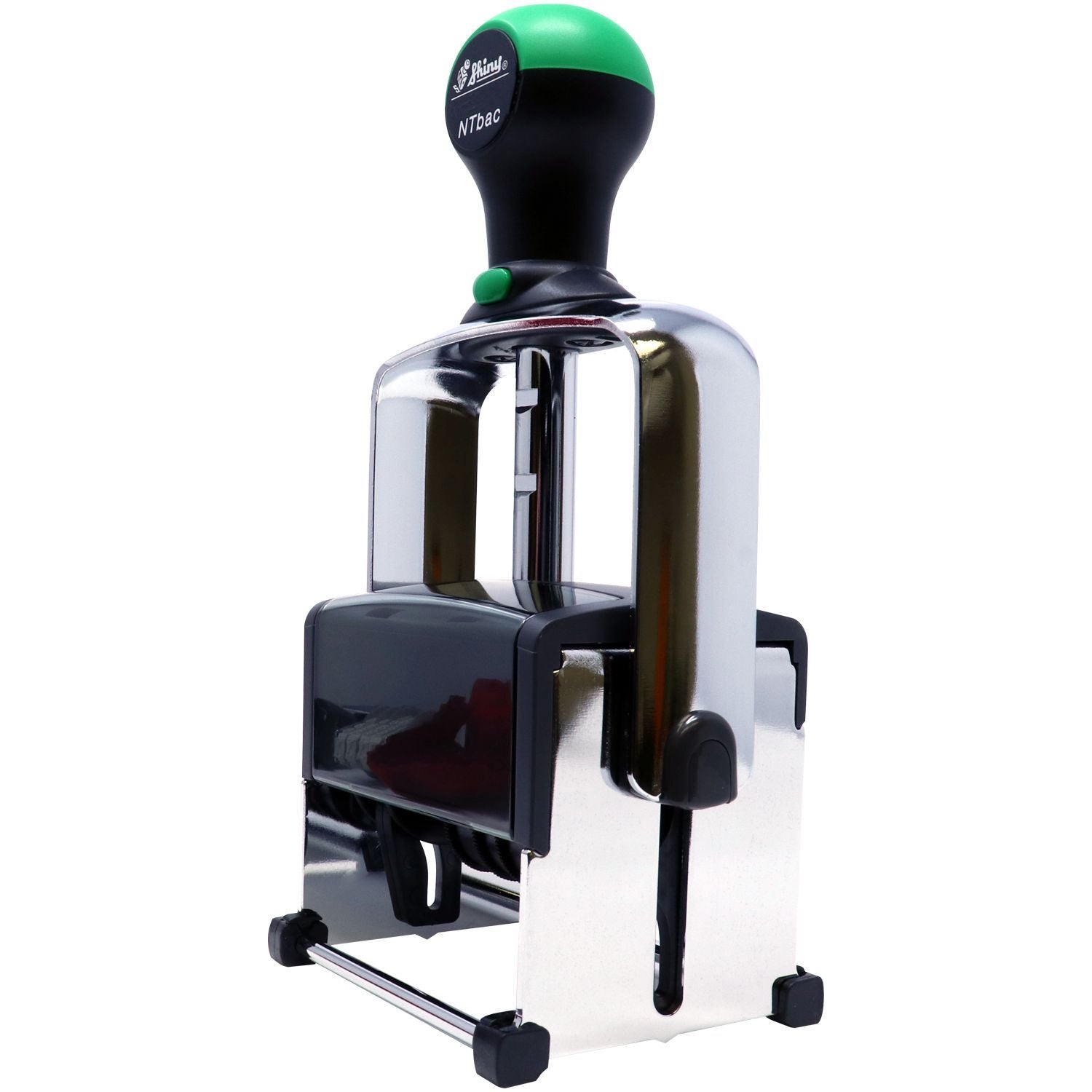 Black and green self-inking rubber stamp with chrome frame on a white background