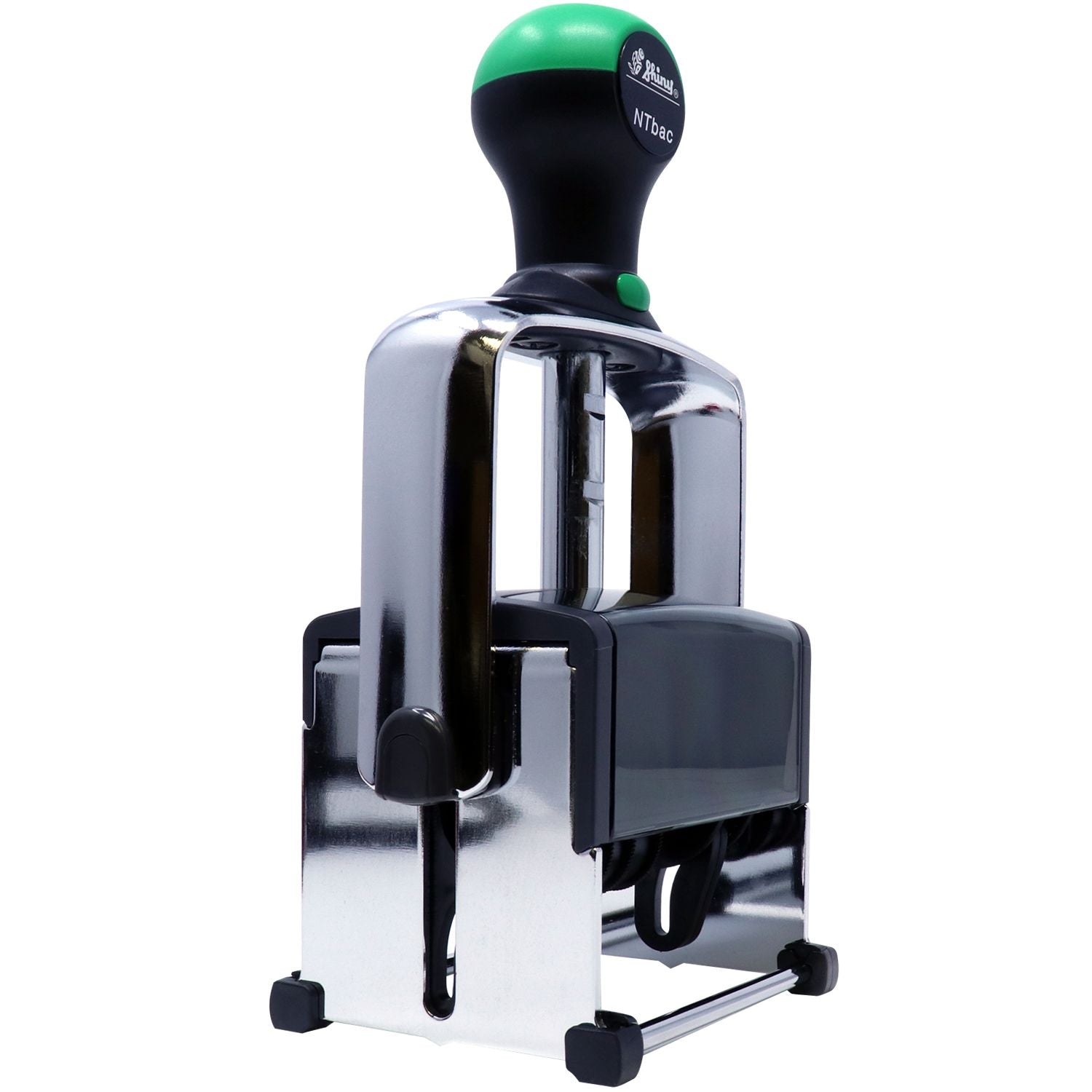 Industrial self-inking rubber stamp with chrome frame and green handle on white background
