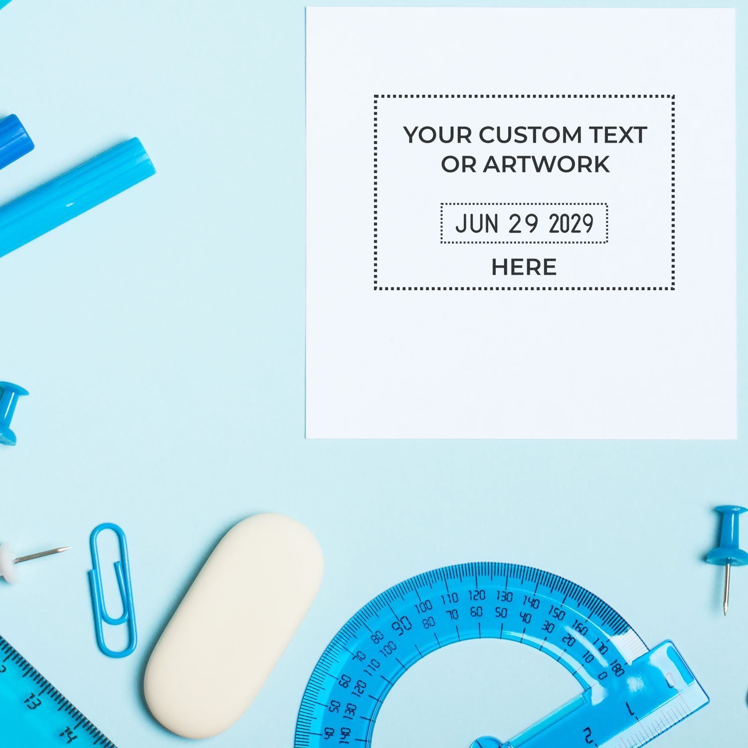 Customizable stationery mockup with blue school supplies, blank paper, and editable text space on a light blue background.
