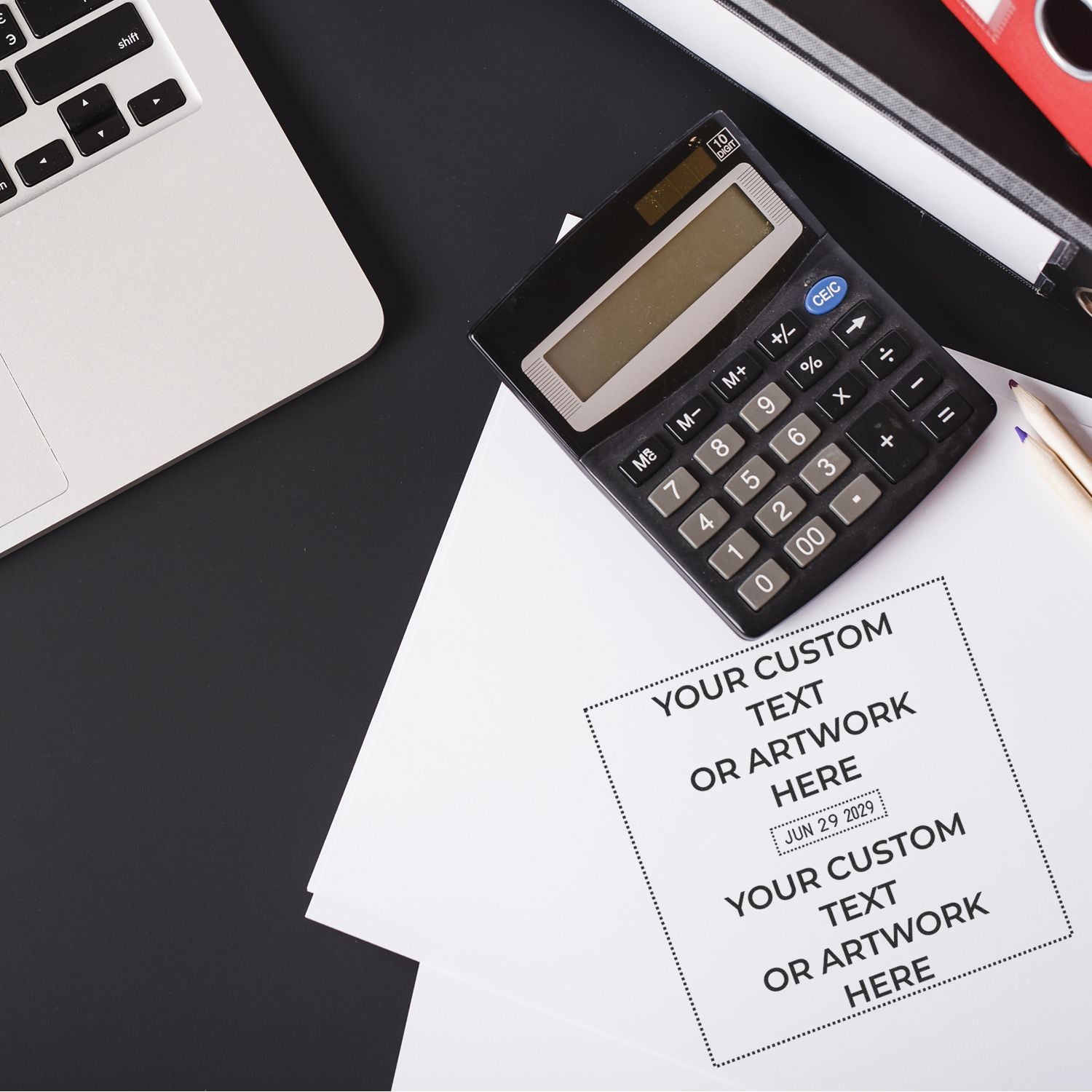 Top view of laptop, calculator, and customizable flyer mockup on an office desk for business finance and design planning.