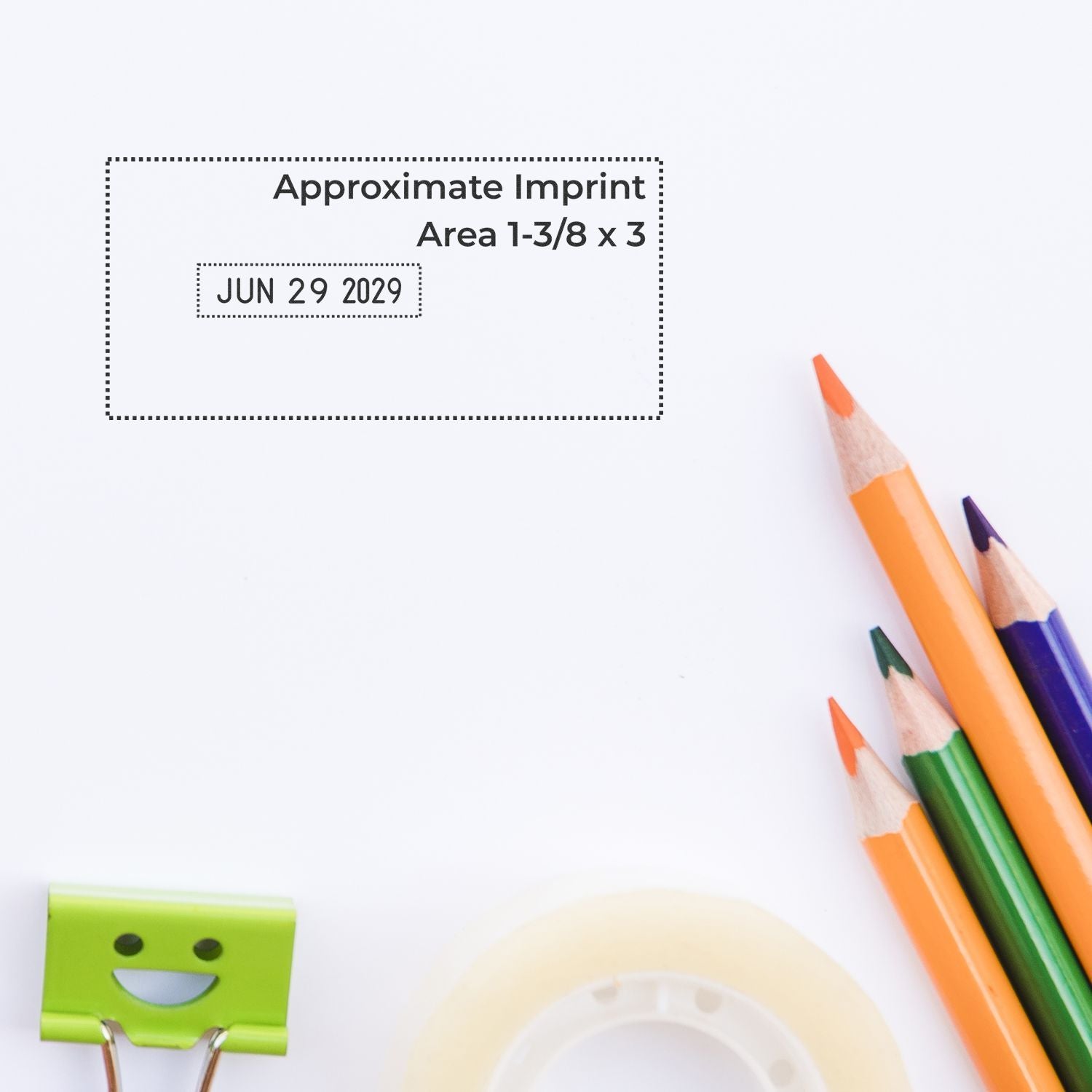 Blank stationery mockup with approximate imprint area, date stamp, colored pencils, paper clip, and tape on a white background.