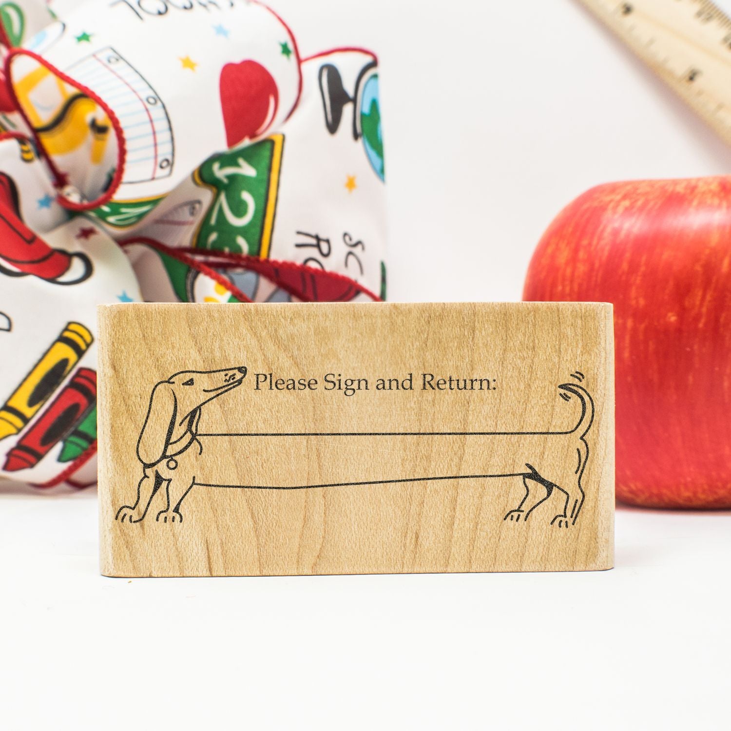 Wooden dachshund Please Sign and Return rubber stamp with school supplies background