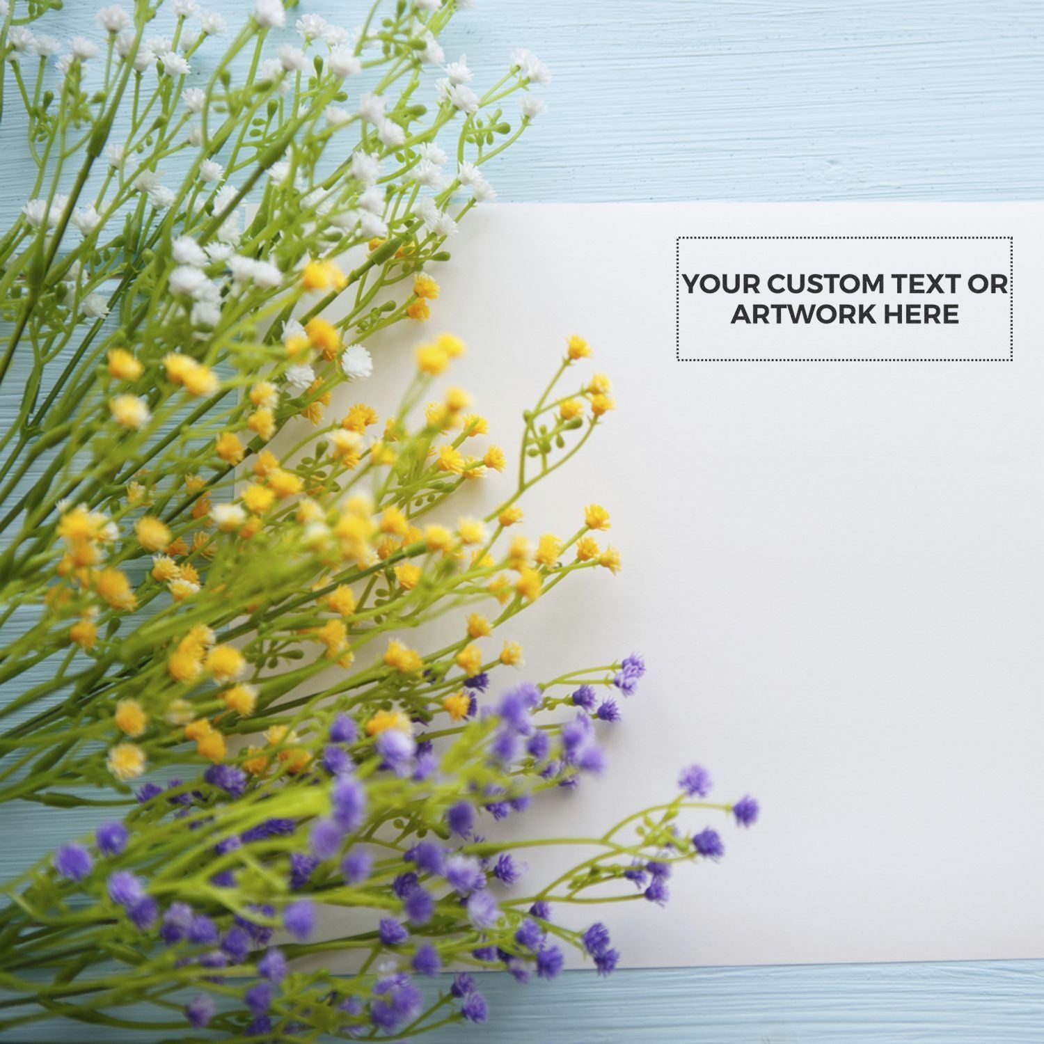 Spring wildflower bouquet on blue wooden background with space for custom text or artworkideal for greeting cards.