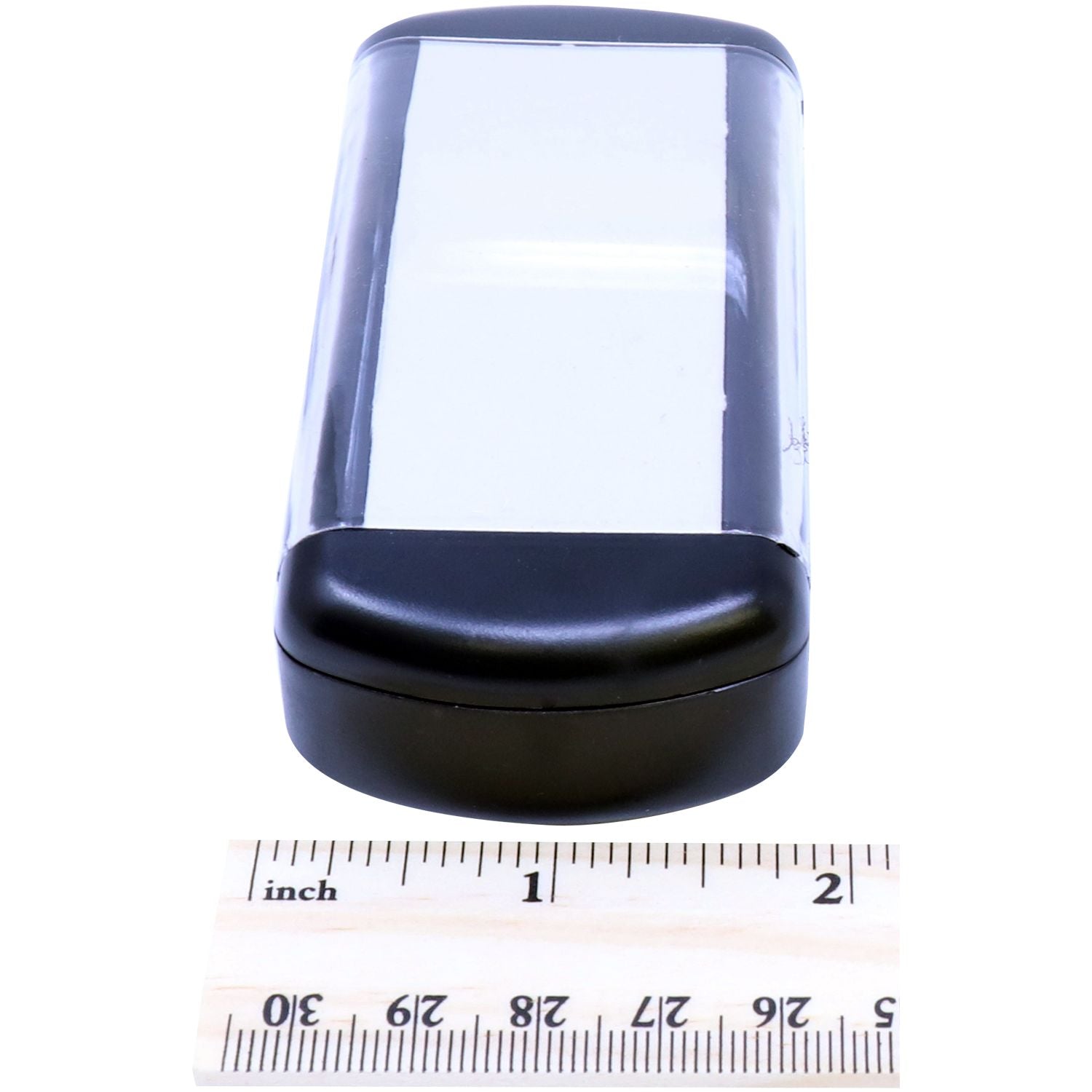 Close-up of black cylindrical device with clear window, shown with inches ruler to verify accurate product sizing for buyers online.