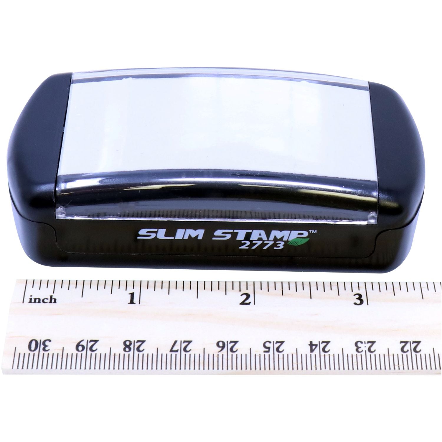 SLIM STAMP 2773 date stamp product shown next to inch ruler, illustrating compact size for labeling and shipping applications use.