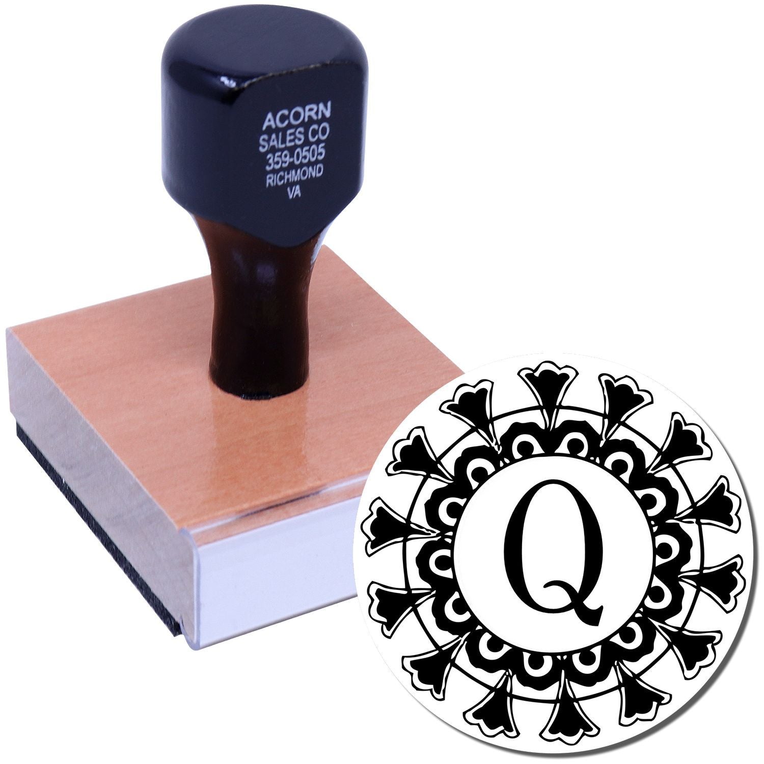Acorn Sales Co stamp with black letter Q on clear plastic base, branded handle for office labeling and imprinting.